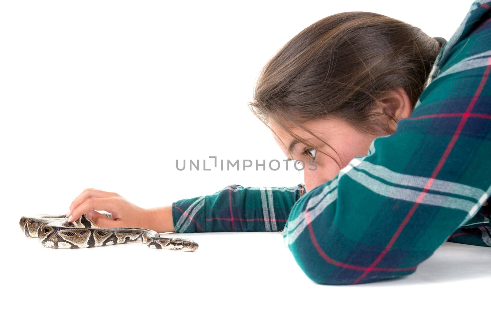 Girl playing with a snake isolated in white