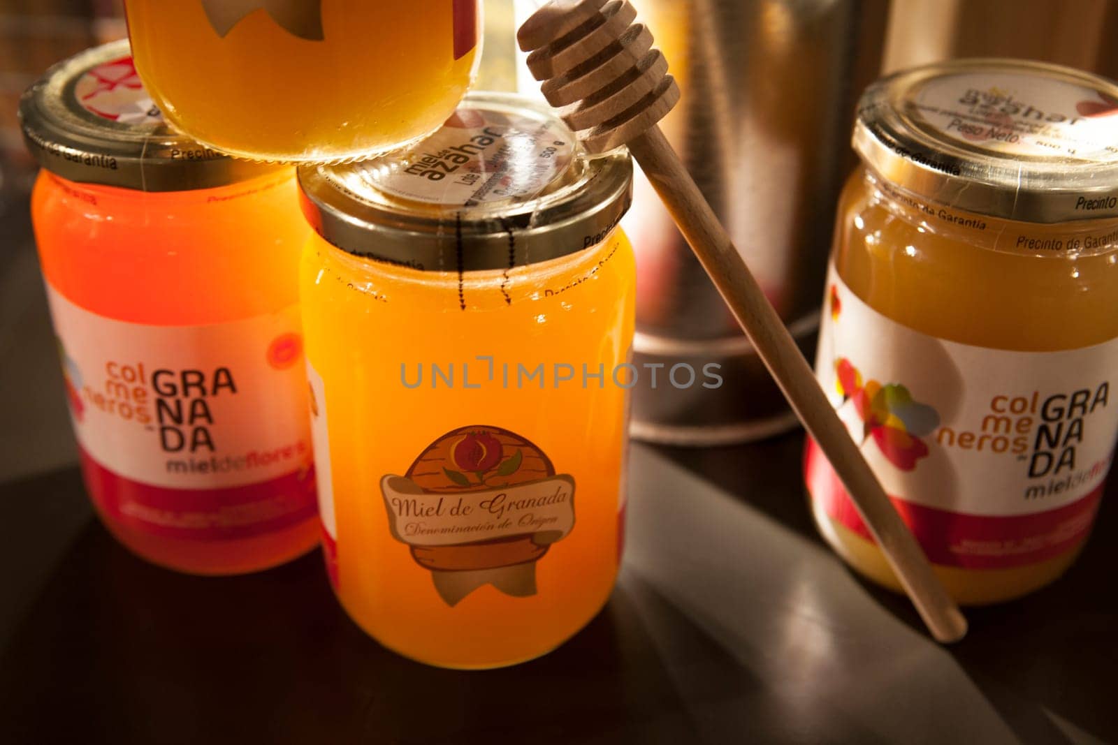 Granada, Spain - August 5, 2016: Stand with traditional wares of honey, typical product from Granada Alpujarras Region, Spain