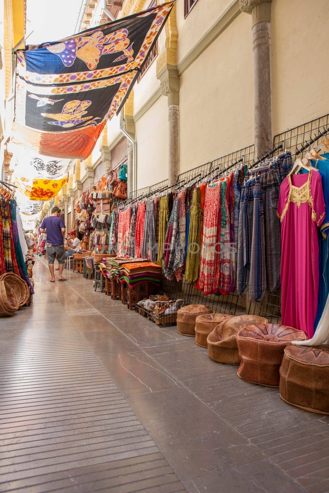 Granada, Spain - August 5, 2016: Narrow streets filled with shops called Alcaiceria, originally home to a Moorish silk market, Granada, Spain