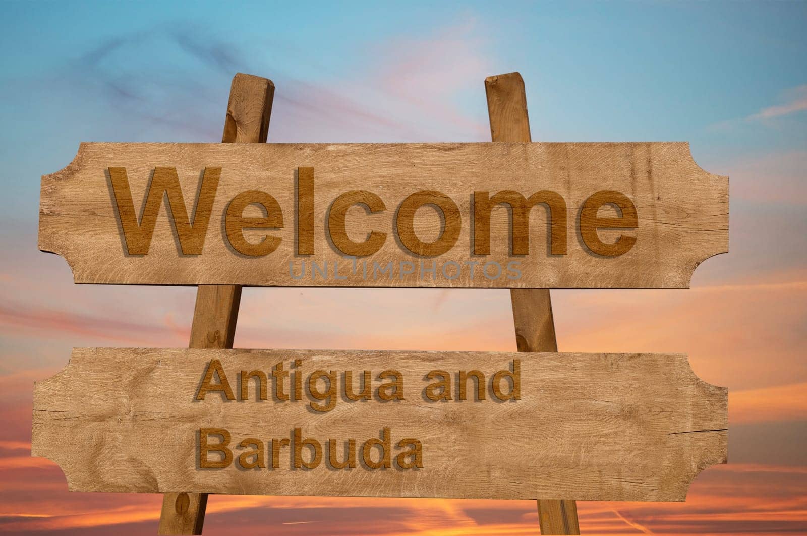 welcome to antigua and barbuda sing on wood background