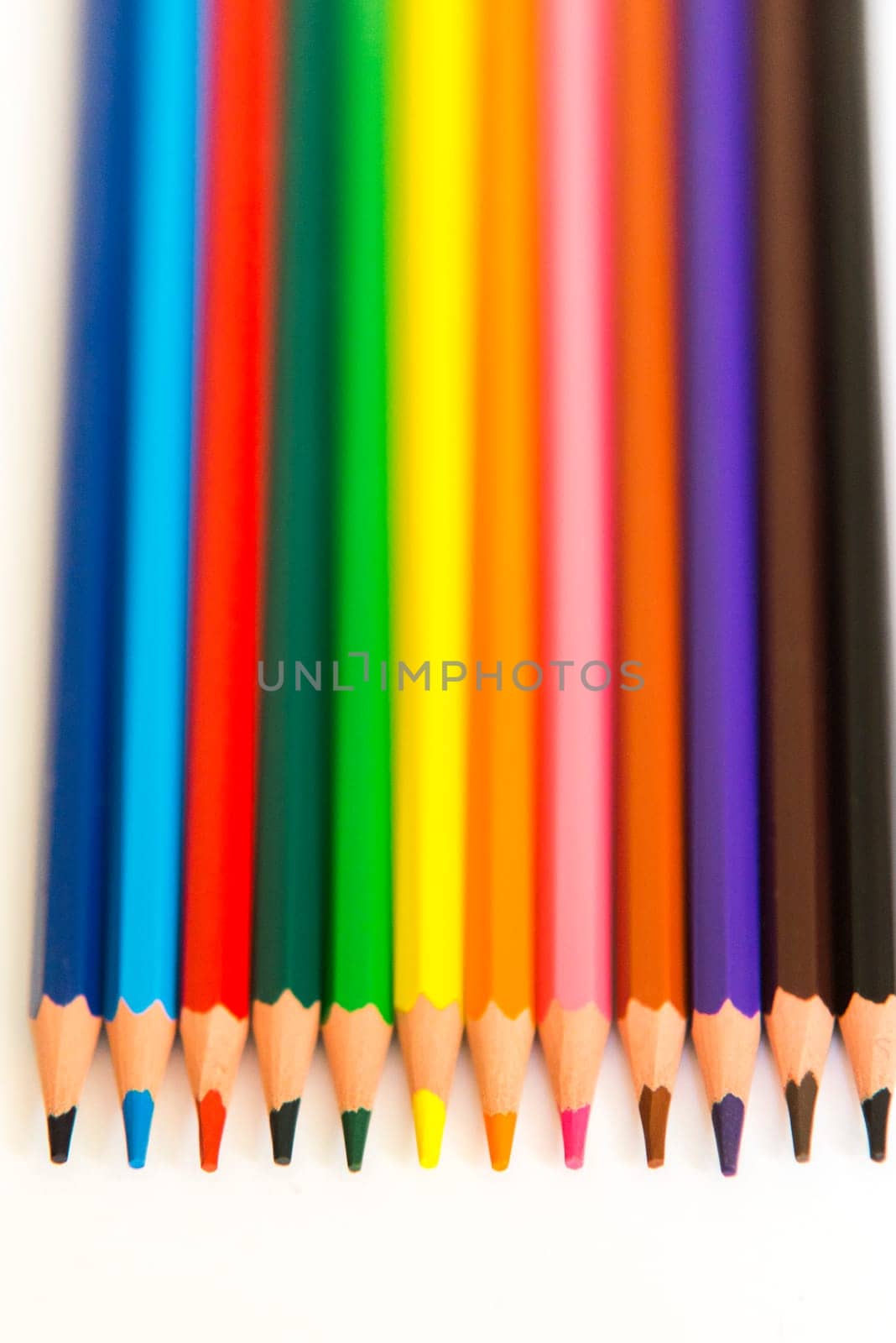 colorful pencils isolated on a white paper background