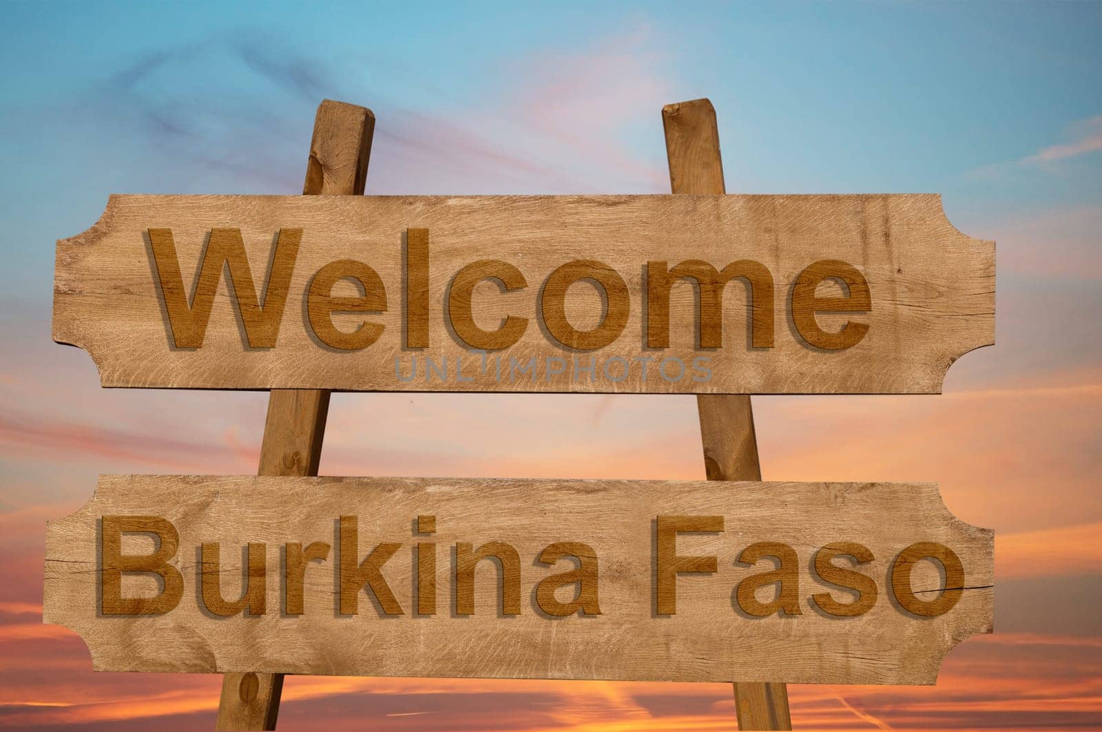 welcome to burkina faso sing on wood background