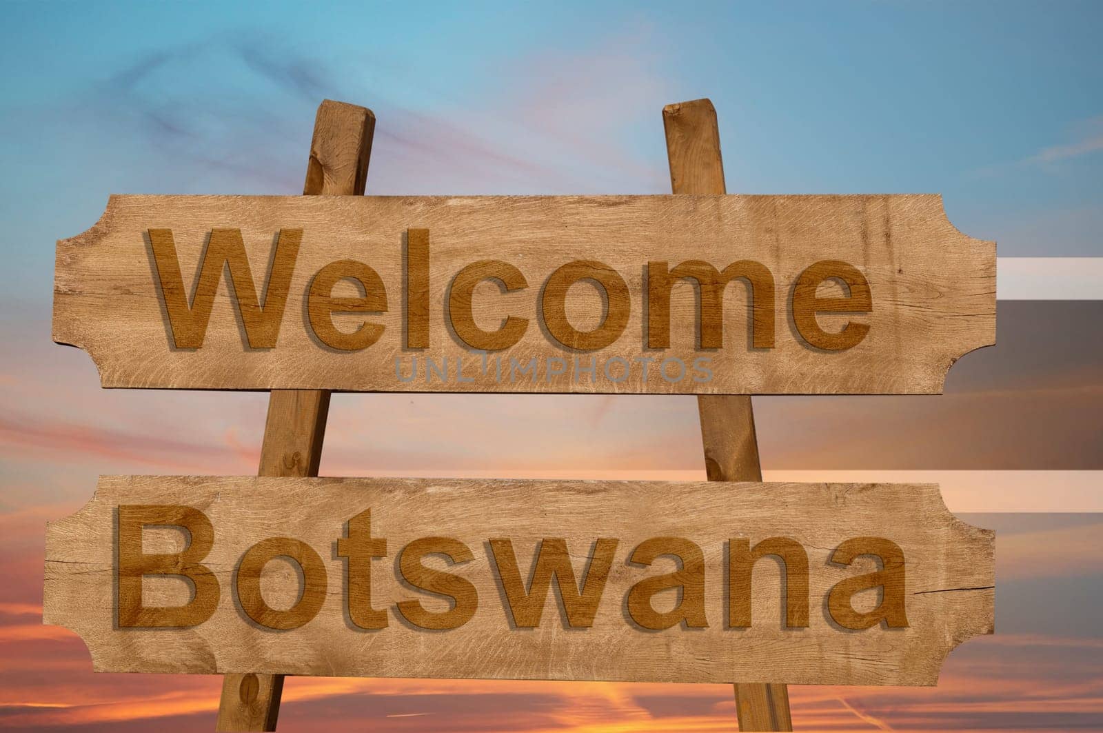 welcome to botswana sing on wood background with blending national flag