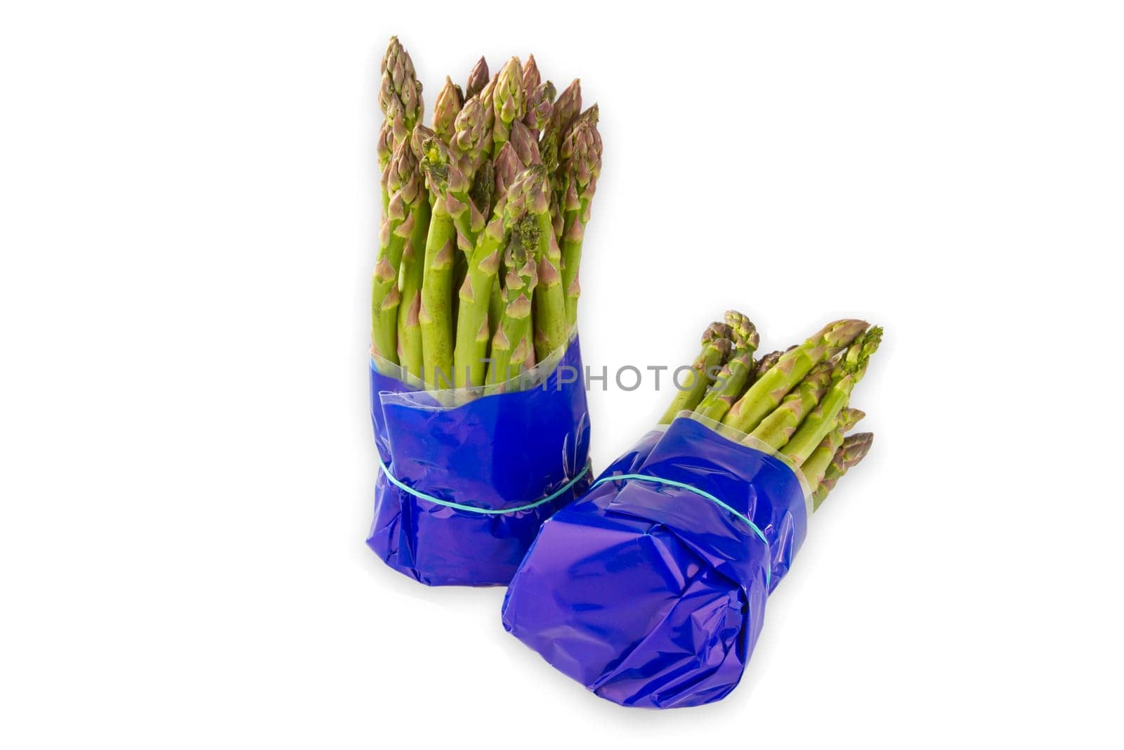 Fresh green asparagus exposed on a white background