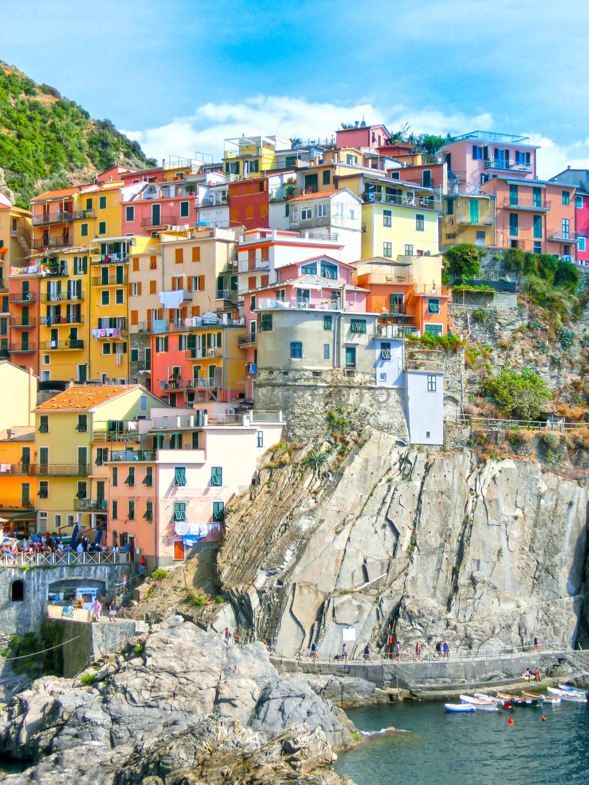 Colorful traditional houses on a rock over Mediterranean sea t, Manarola, Cinque Terre, Italy