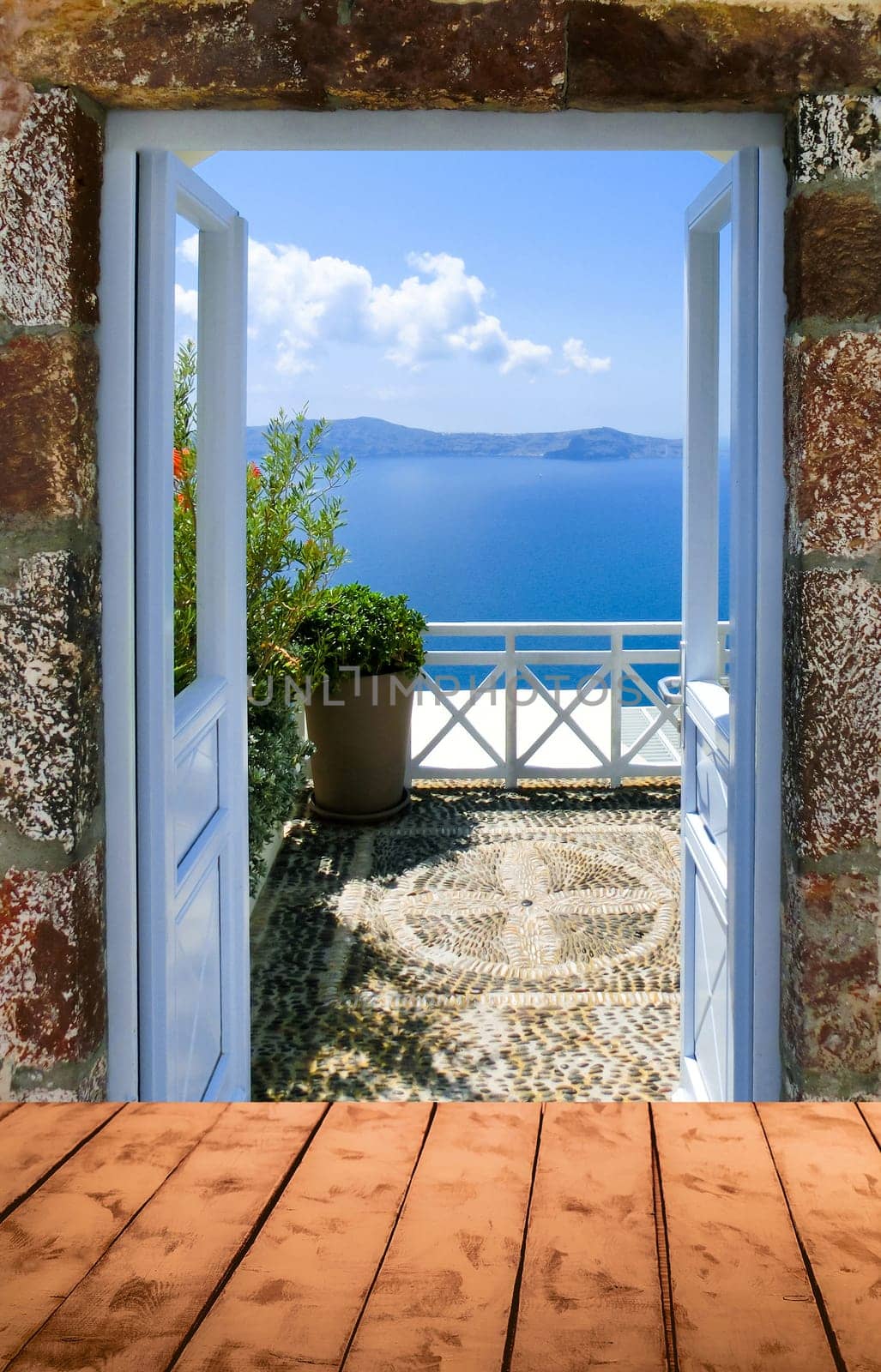 Beautiful sea view from the balcony. Oia town, Santorini island, Greece. View from wooden background