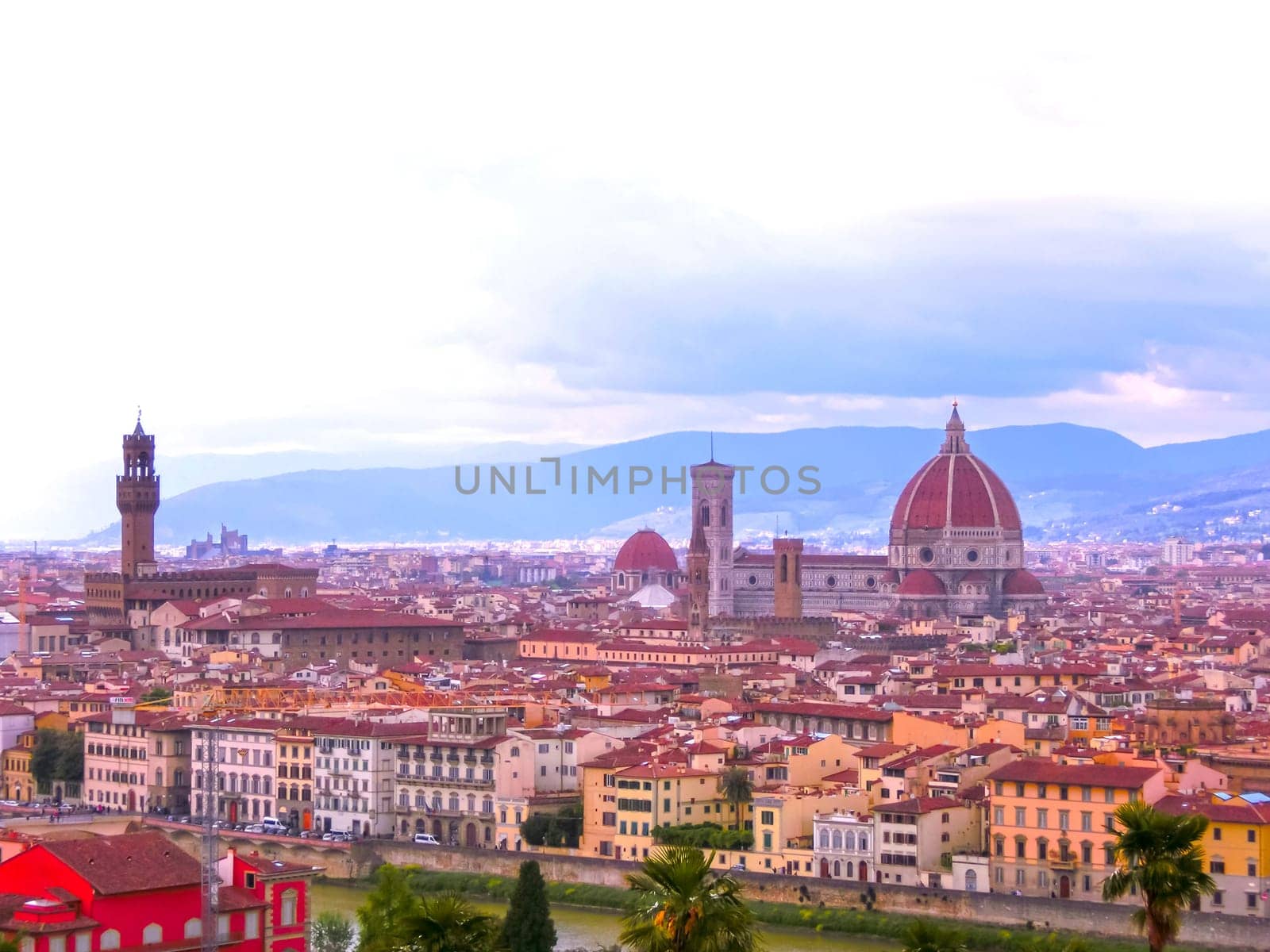 View of the Cathedral Santa Maria del Fiore in Florence, Italy - Florence's cathedral stands tall over the city with its magnificent Renaissance dome designed by Filippo Brunelleschi.
