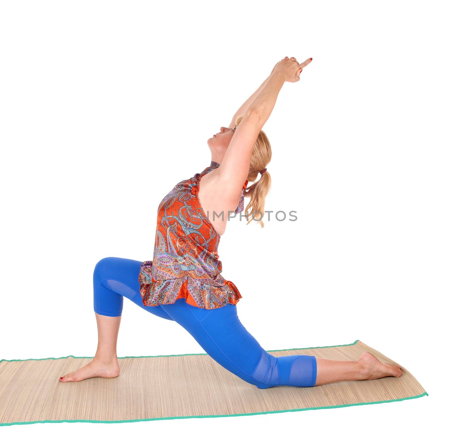 A pretty woman with blond hair stretching on a matt with a yoga pose,.isolated for white background..