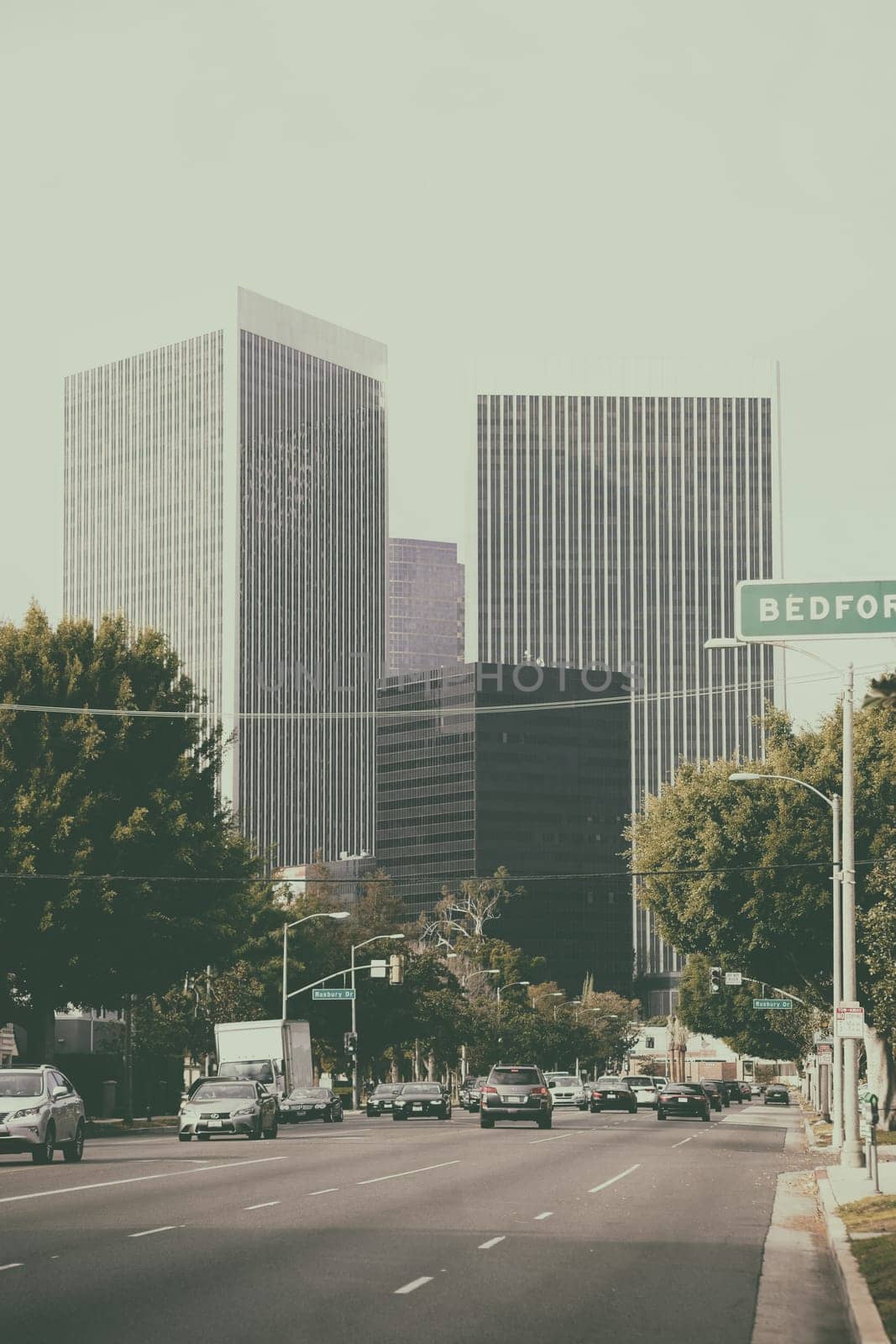 Los Angeles,United States - December 27,2015: Road traffic on a multi-lane road leads to downtown Los Angeles with various high-rise buildings on December 27,2015 in Los Angeles.