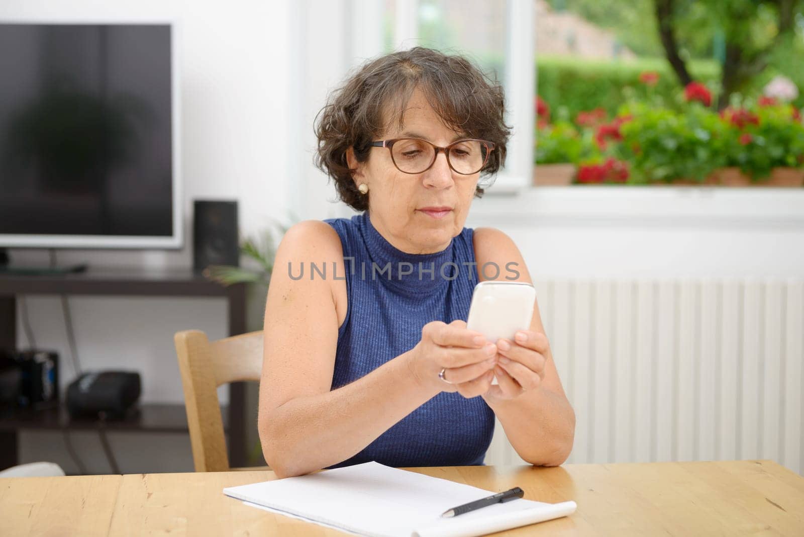 a portrait of a mature woman with a phone