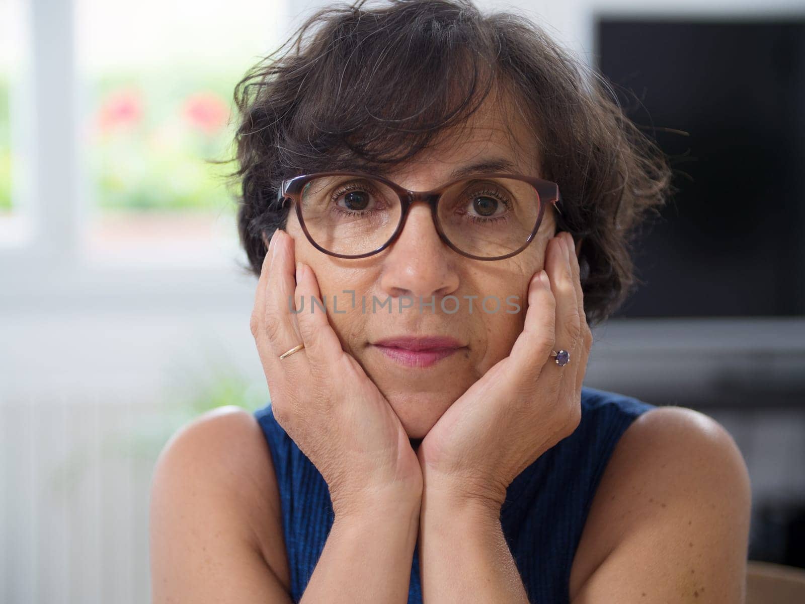 a portrait of a mature woman with glasses