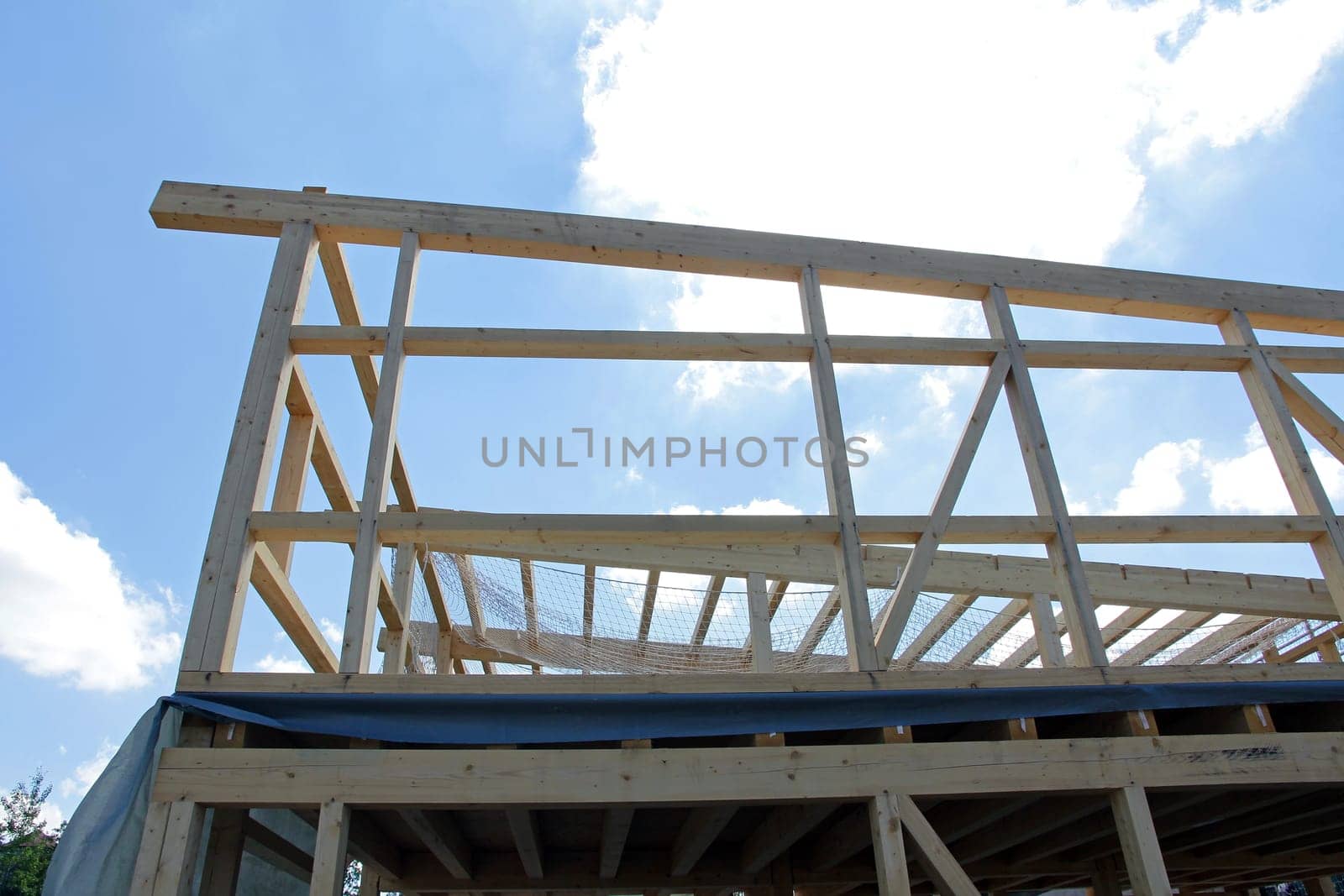 The new construction of a wooden house. Shell of a wooden house