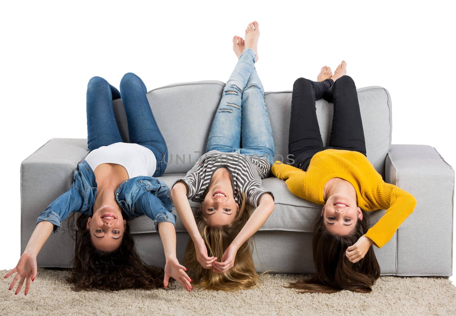 Happy teen girls at home lying in the floor