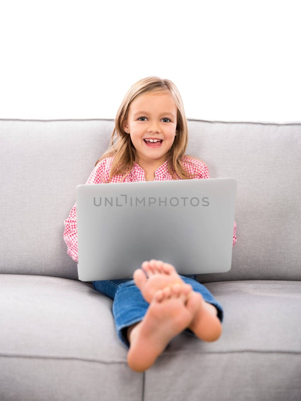 Cute little girl at home studying