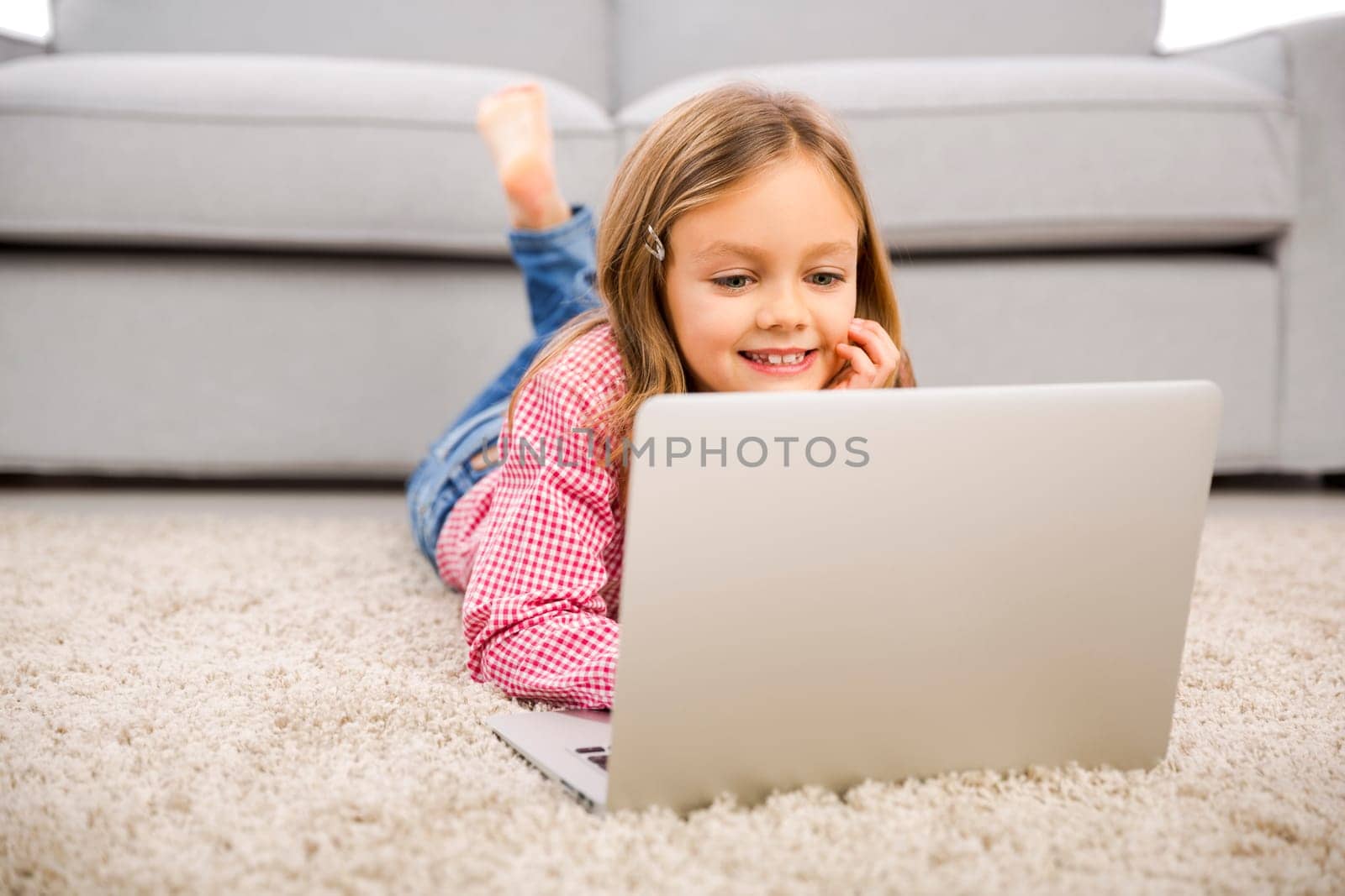Cute little girl at home studying