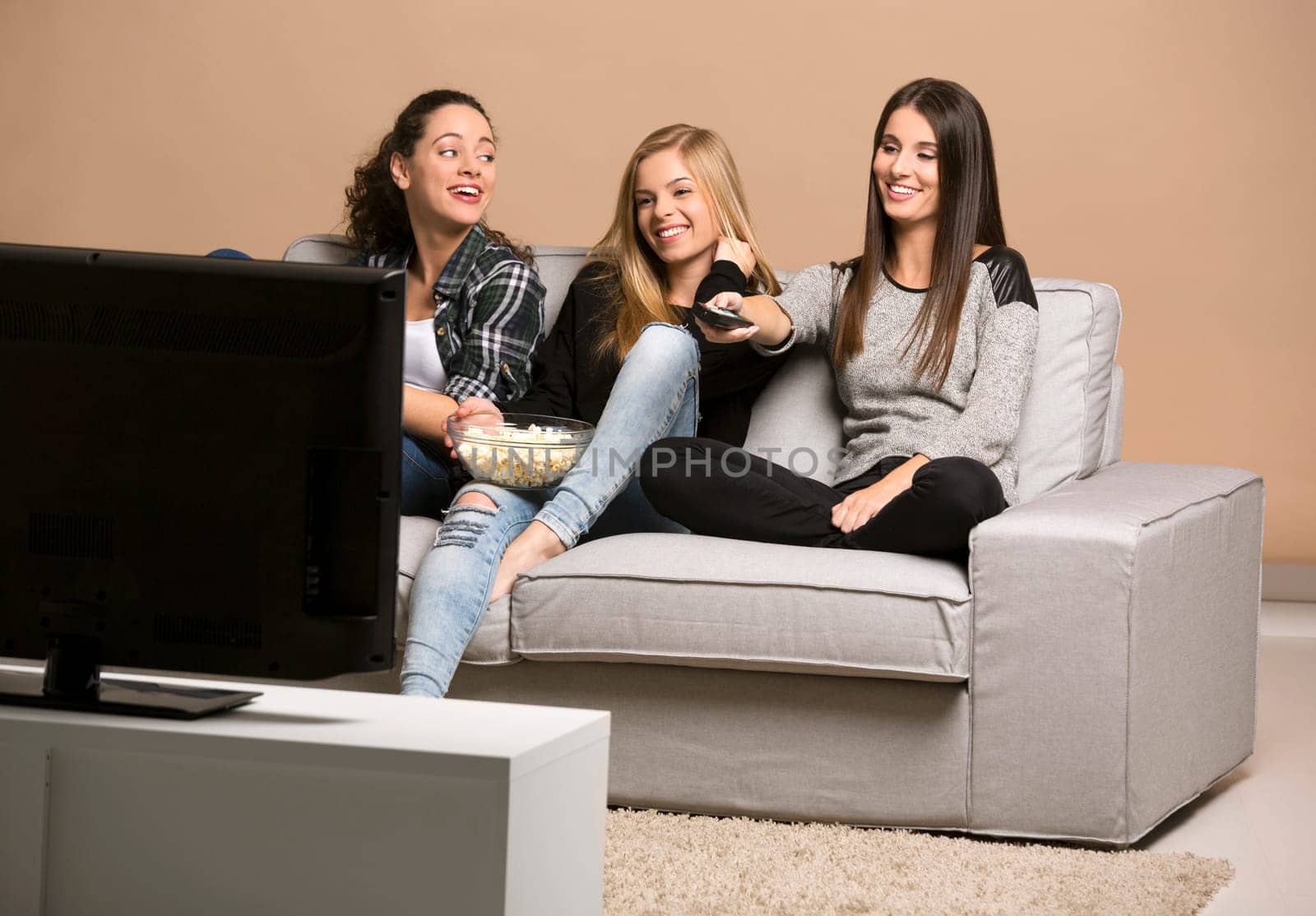 Girls watching 3D movies with popcorn