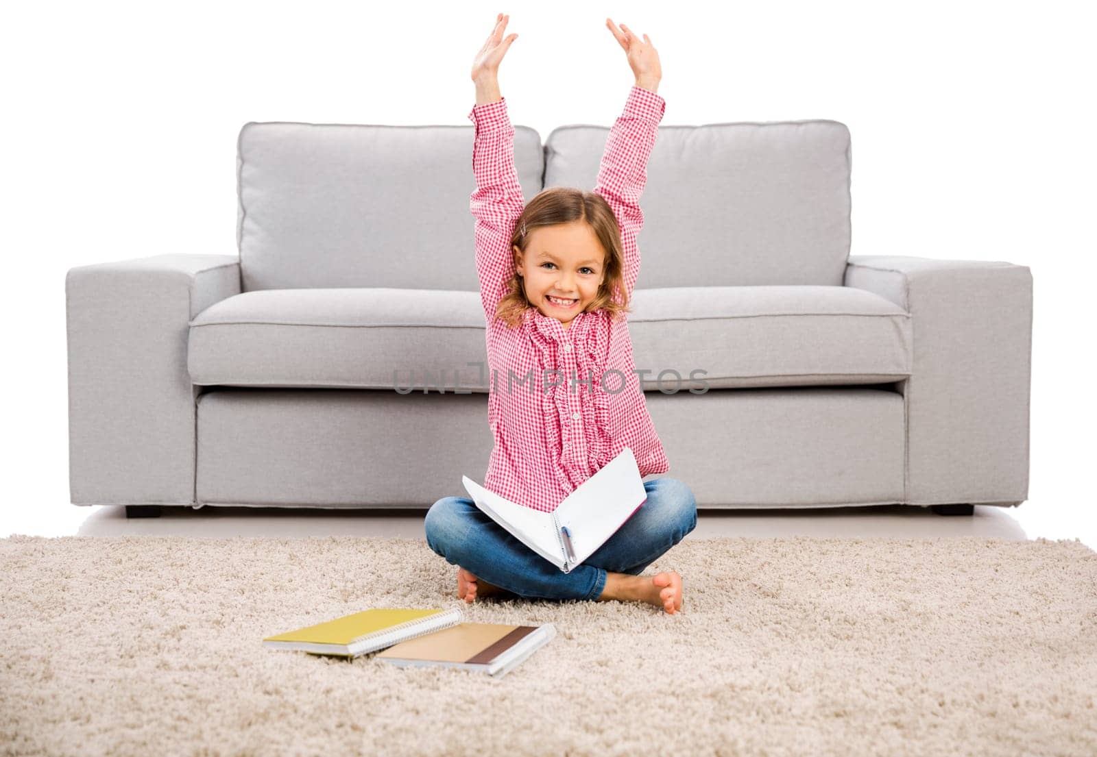 Cute little girl at home studying