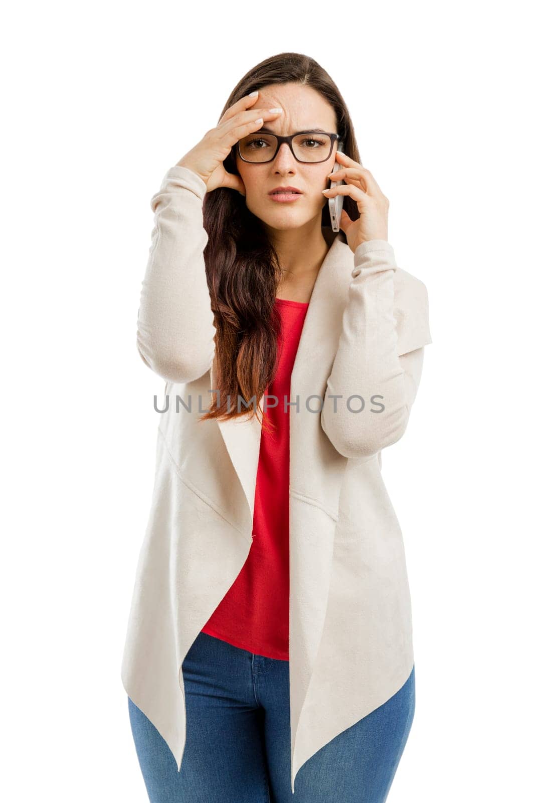 Stressed woman talking on the phone, isolated over white background