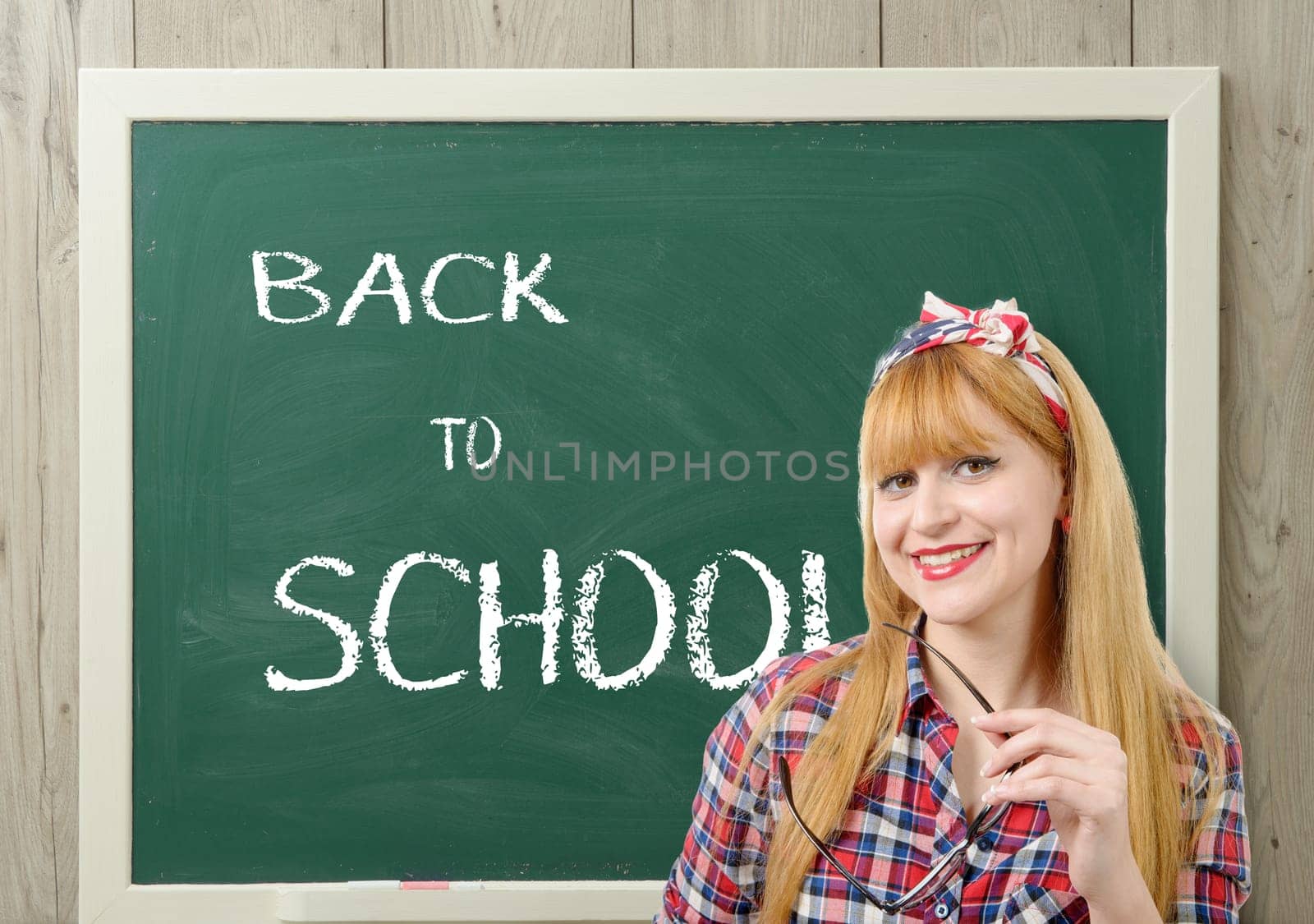 back to school, a pretty teacher with black glasses
