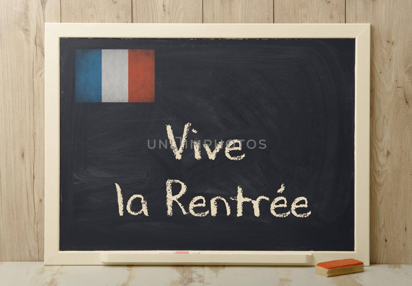 "vive la rentree"" back to school written on a blackboard"