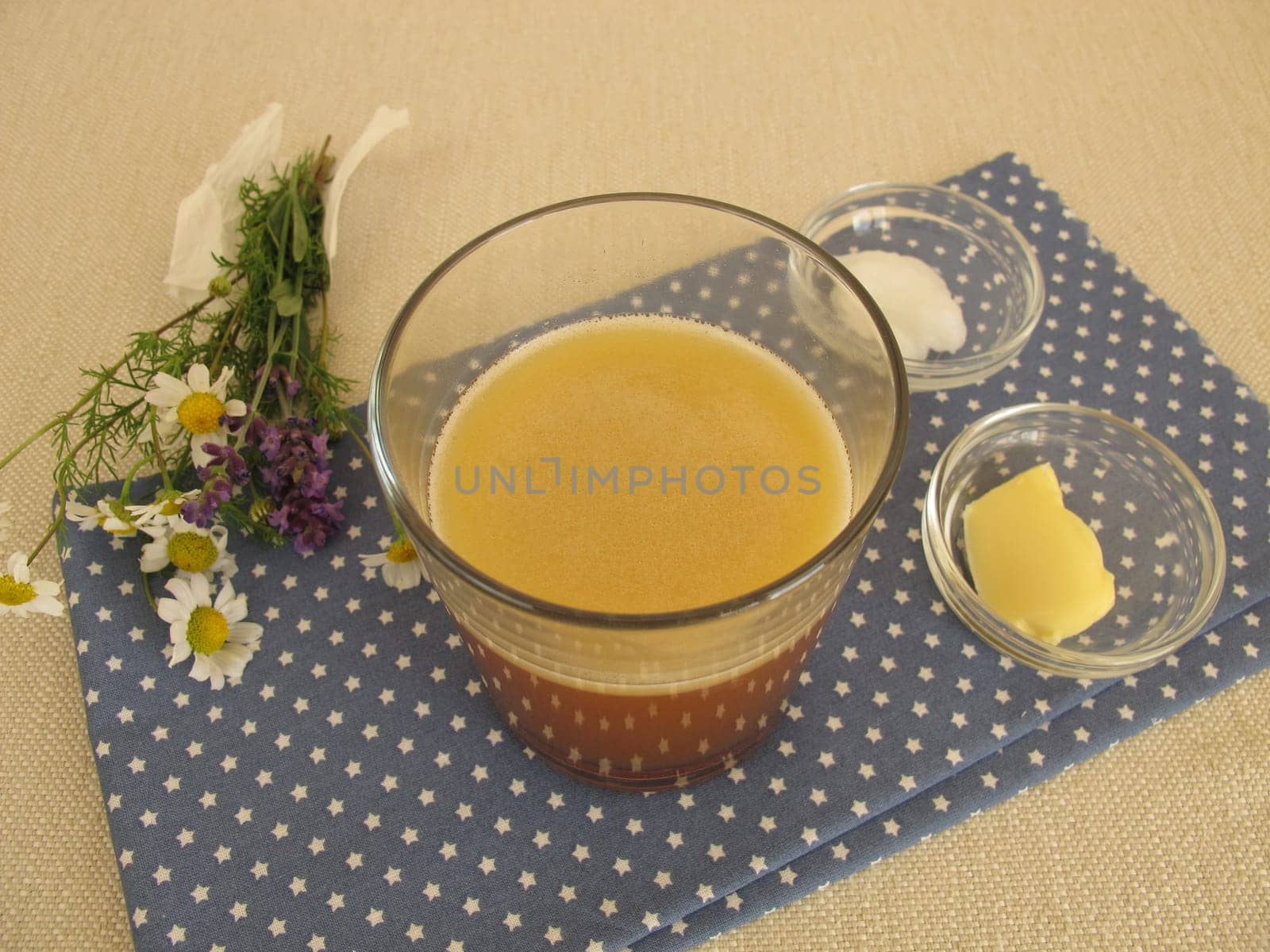 Butter coffee in a glass with butter and coconut oil