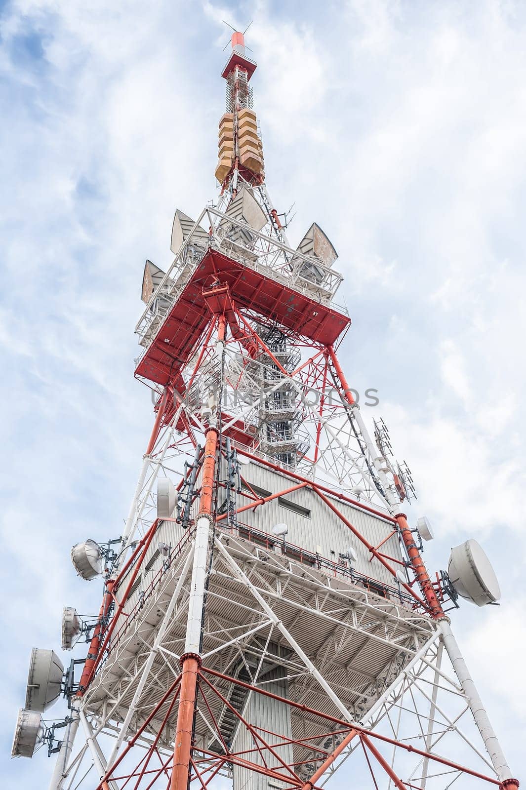 Telecommunication mast TV antennas wireless technology with blue sky in the morning