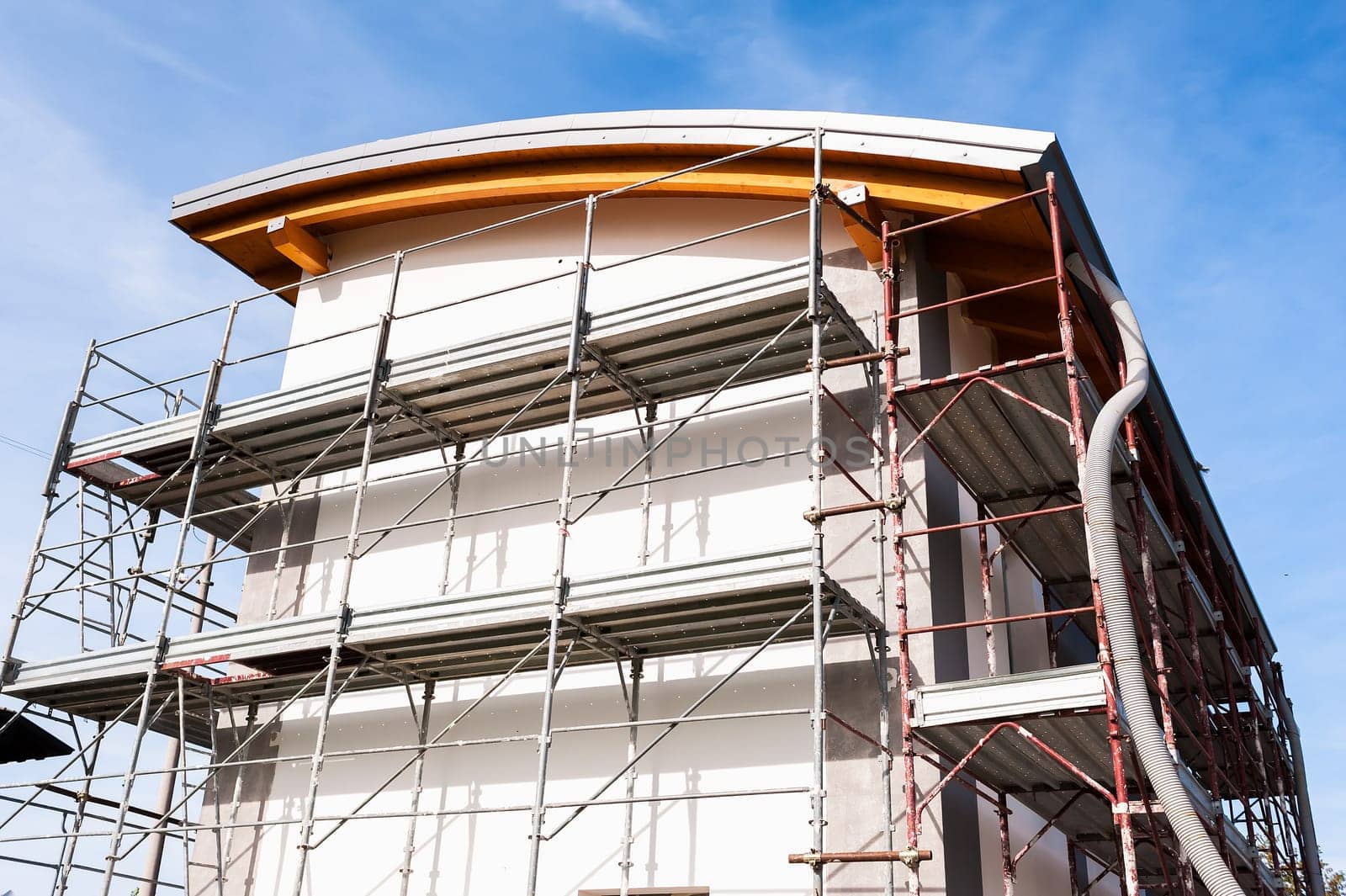 House under renovation with the scaffolding for bricklayers