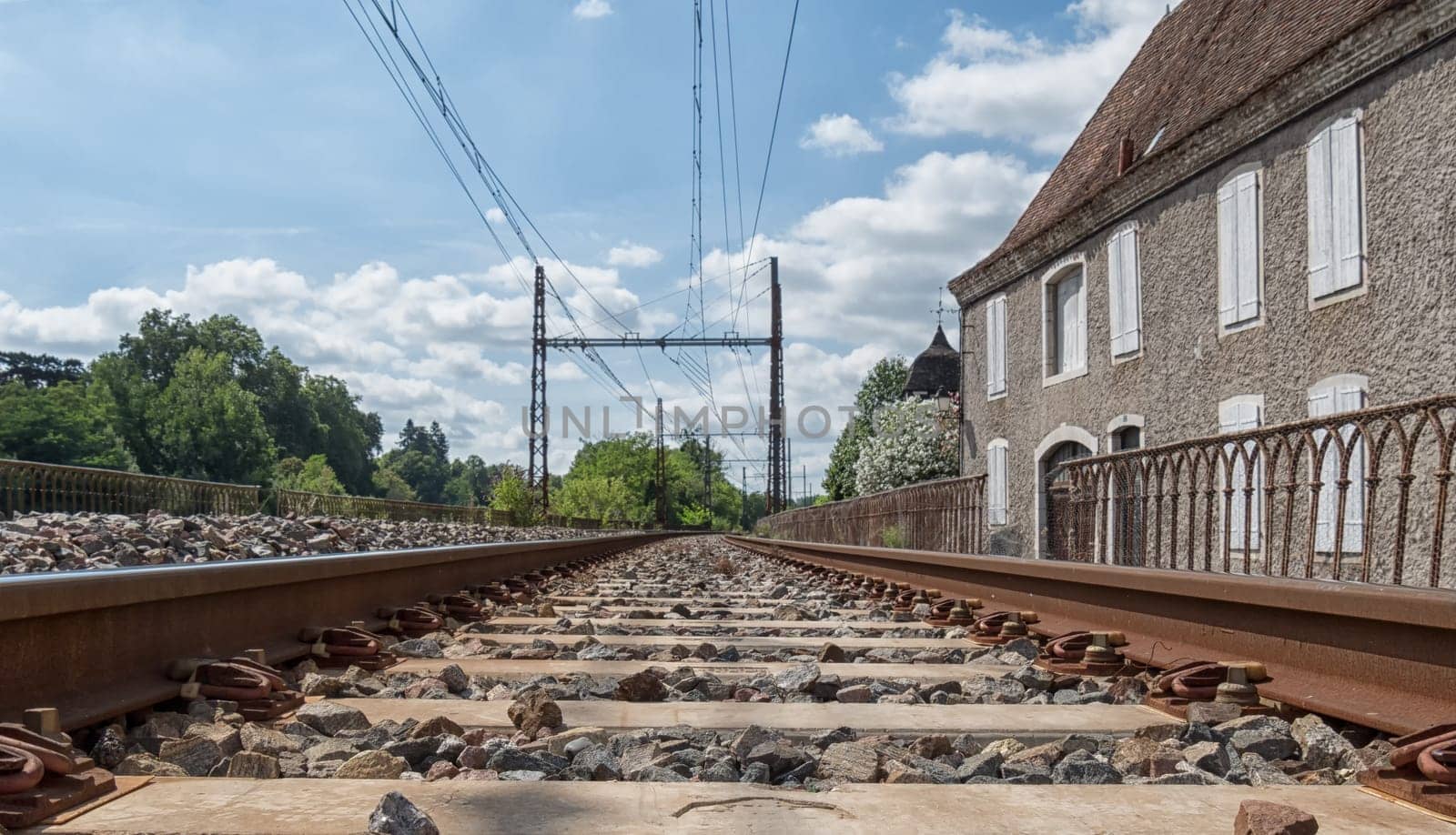 Railway track with Orthez village in France