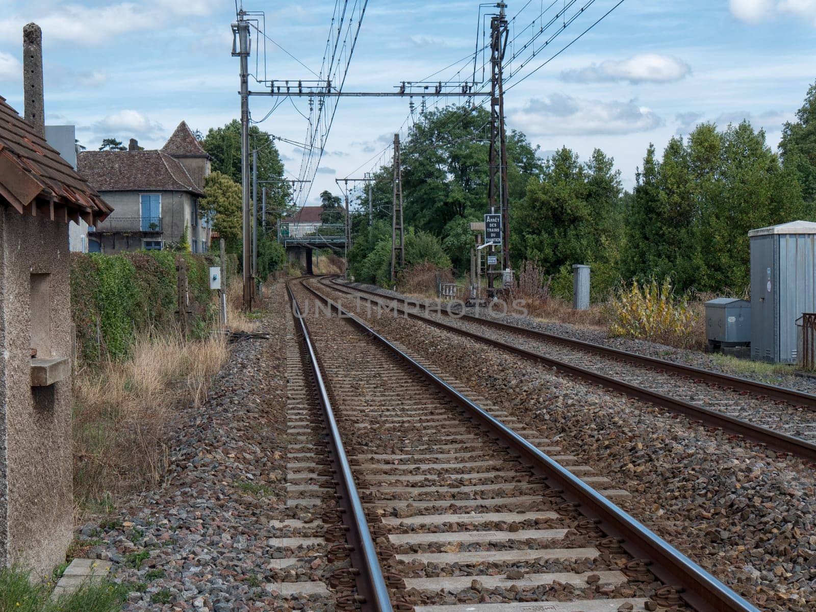 Railway track with Orthez village in France