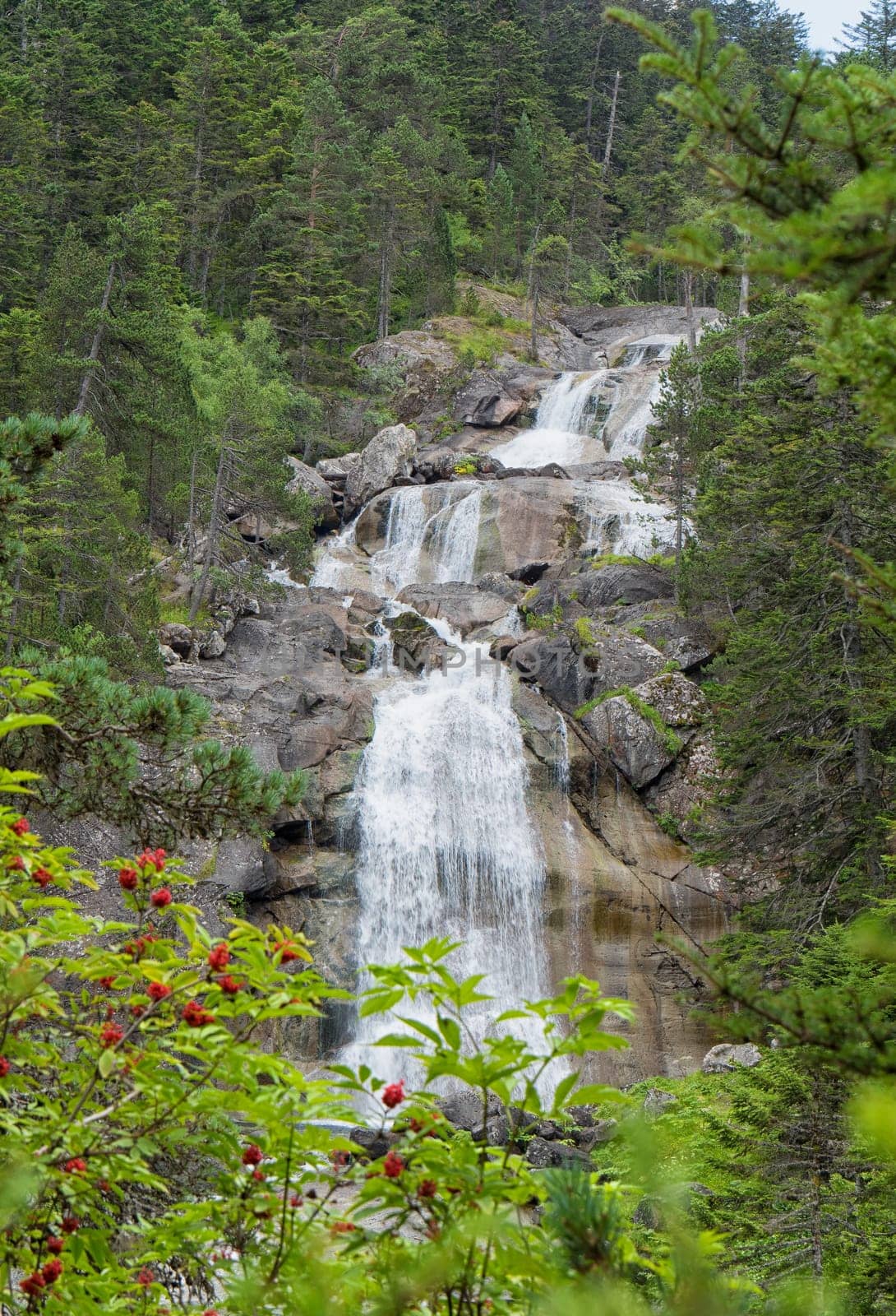 a waterfall in the mountains of the Pyrenees