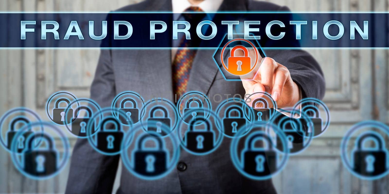 Man in business suit is pushing the capitalized words FRAUD PROTECTION on an interactive touch screen. White collar crime metaphor. Cyber crime and information technology concept. Torso shot.