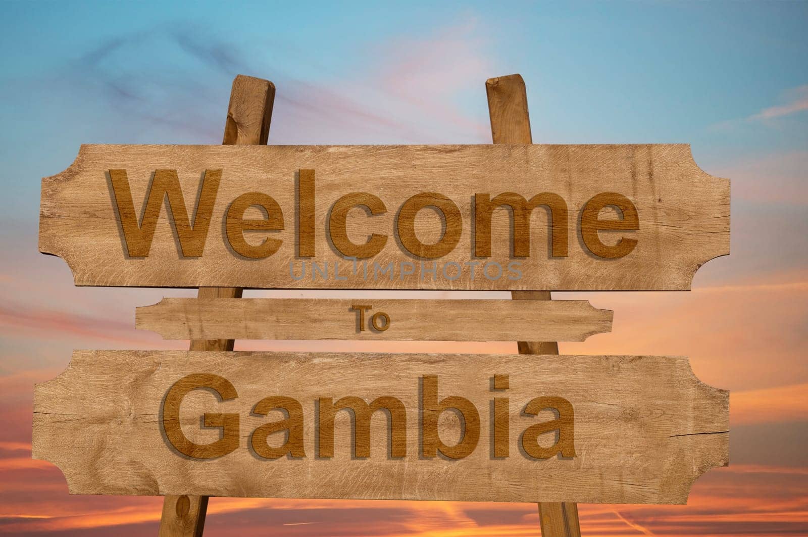 welcome to the gambia sing on wood background