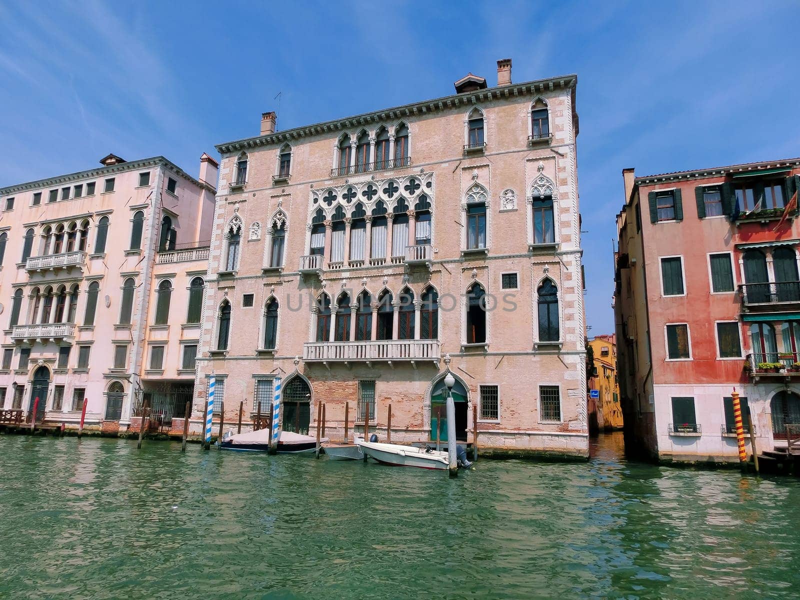 Beautiful view from Grand Canal on colorful facades of old medieval houses in Venice, Italy