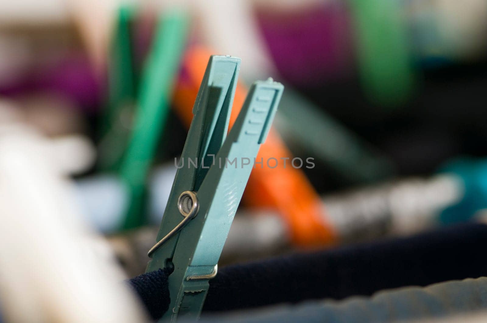 Clothesline with laundry and individually focused clothespin