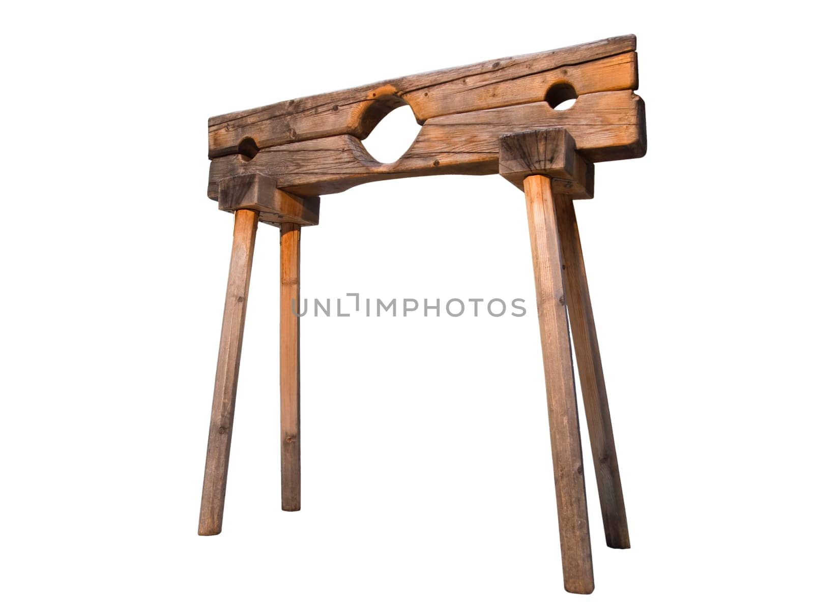 on white exposed photo of a wooden pillory in deep camera position