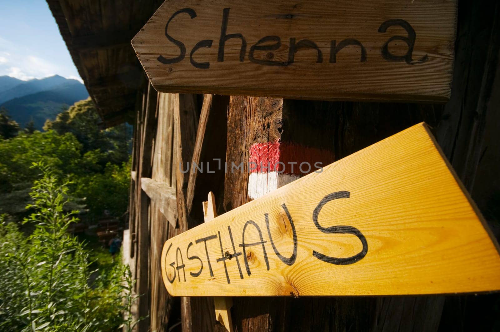 Signpost to the village of Schenna and to a restaurant at a small wooden hut above Merano / South Tyrol
