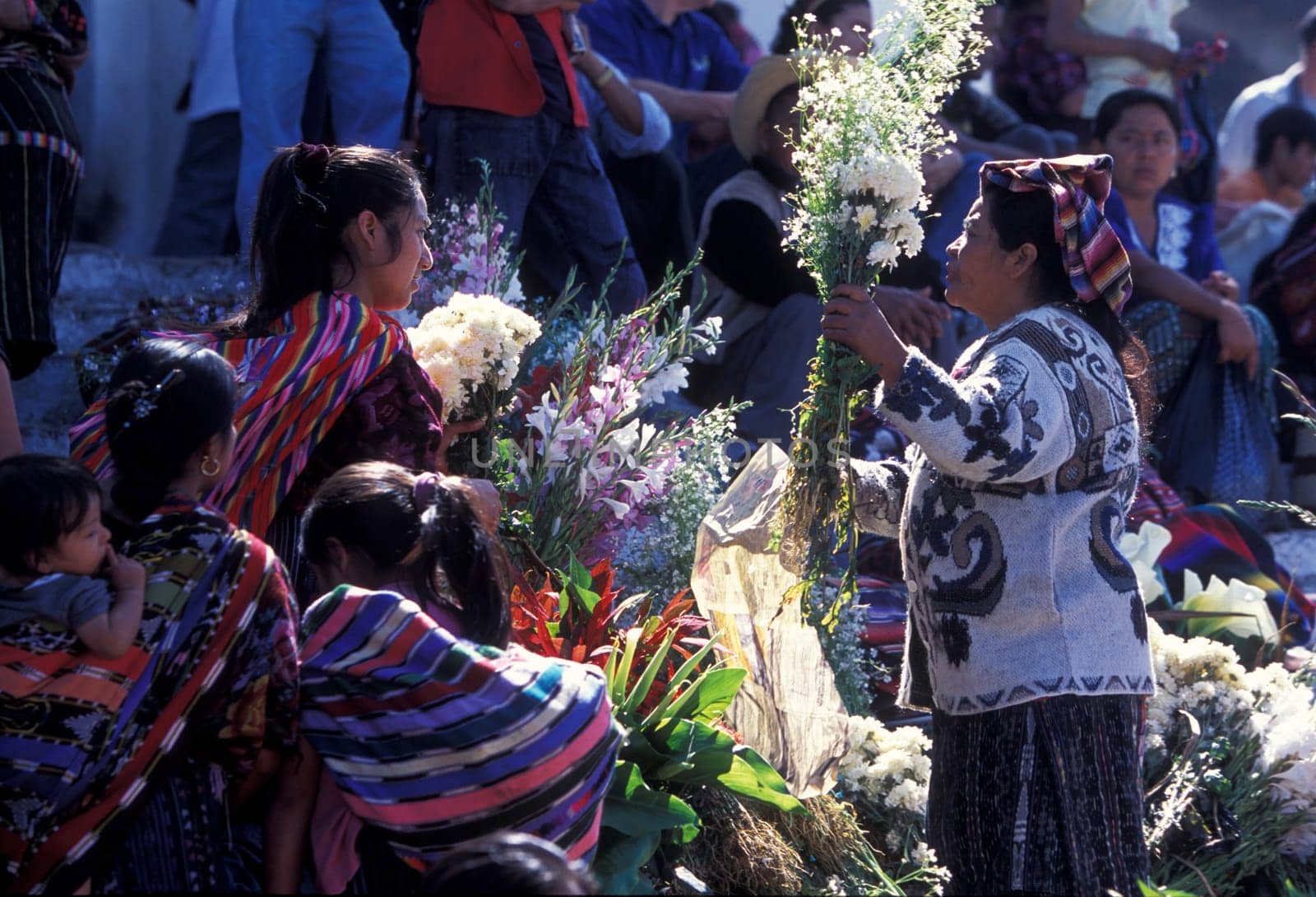People in traditional clotes at the Market in the Village of Chichi or Chichicastenango in Guatemala in Central America.