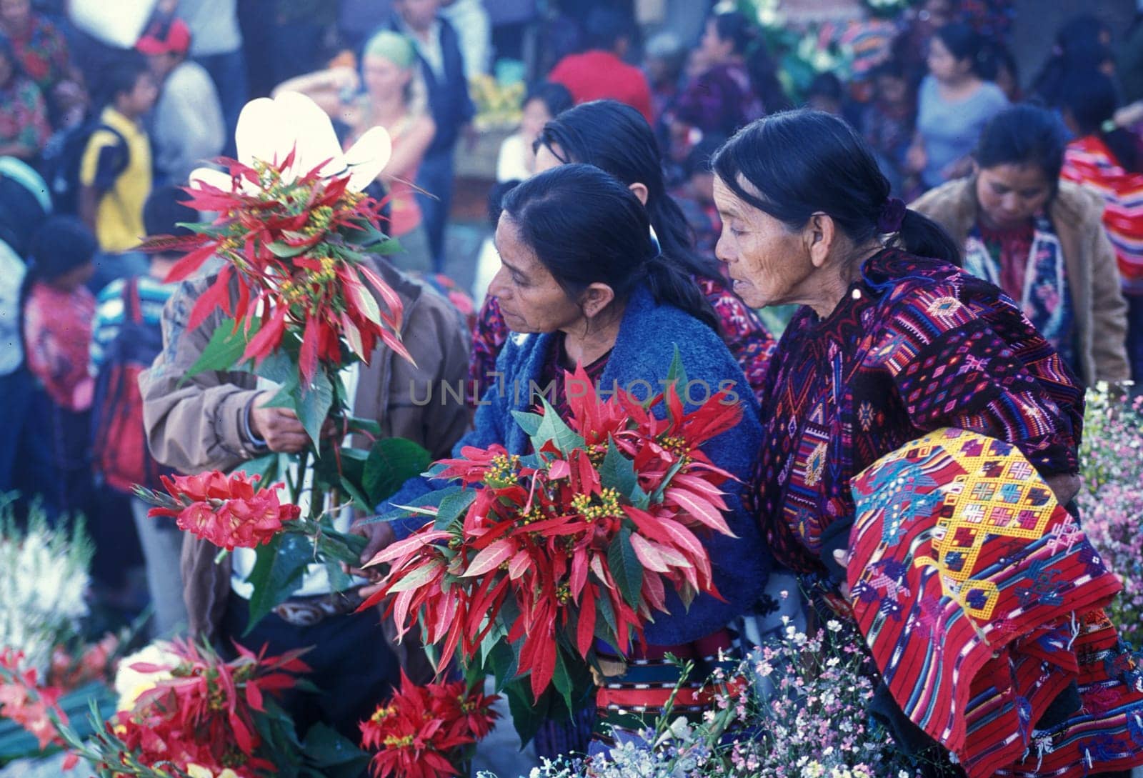 People in traditional clotes at the Market in the Village of Chichi or Chichicastenango in Guatemala in Central America.