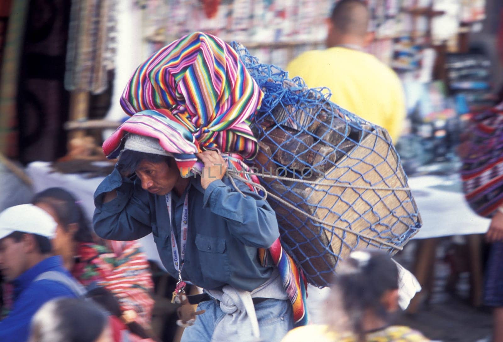 people in traditional clotes at the Market in the Village of  Chichi or Chichicastenango in Guatemala in central America.