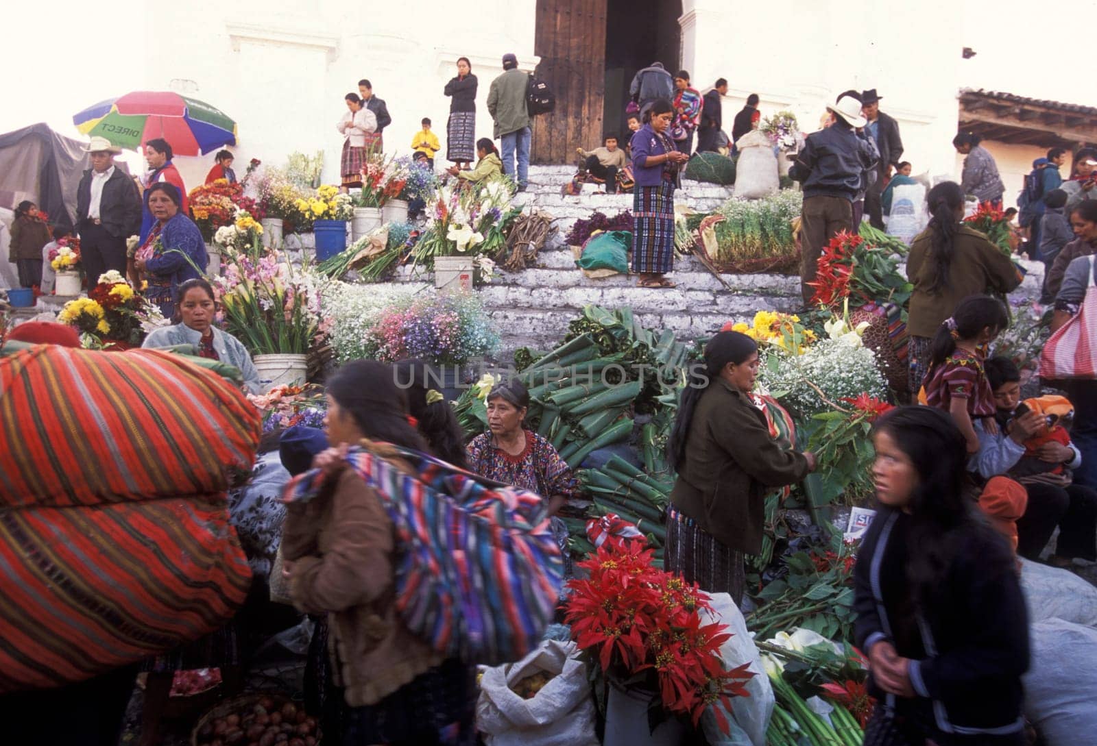 People in traditional clotes at the Market in the Village of Chichi or Chichicastenango in Guatemala in Central America.