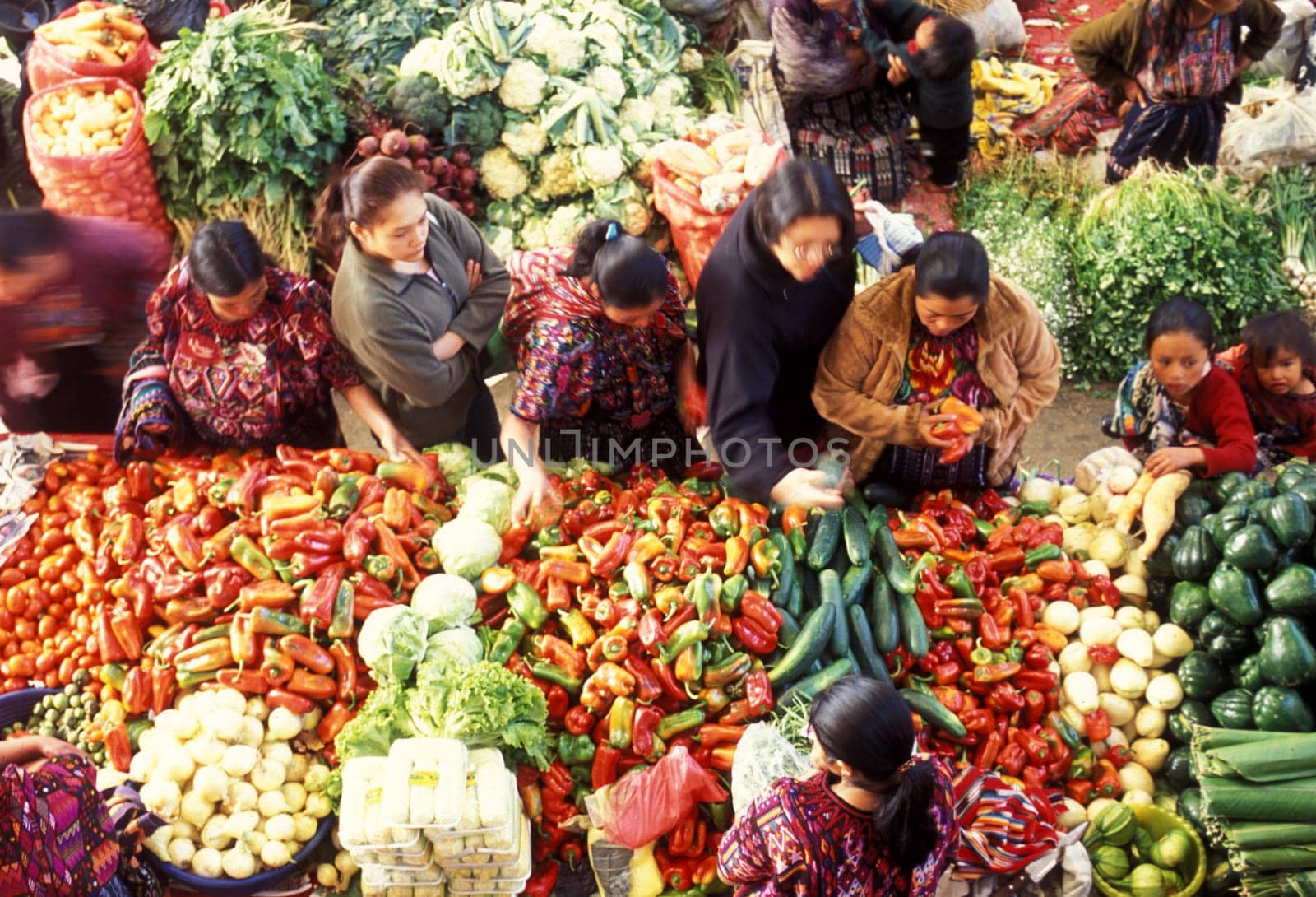 People in traditional clotes at the Market in the Village of Chichi or Chichicastenango in Guatemala in Central America.