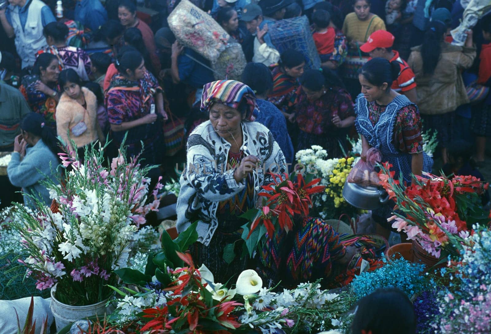 People in traditional clotes at the Market in the Village of Chichi or Chichicastenango in Guatemala in Central America.