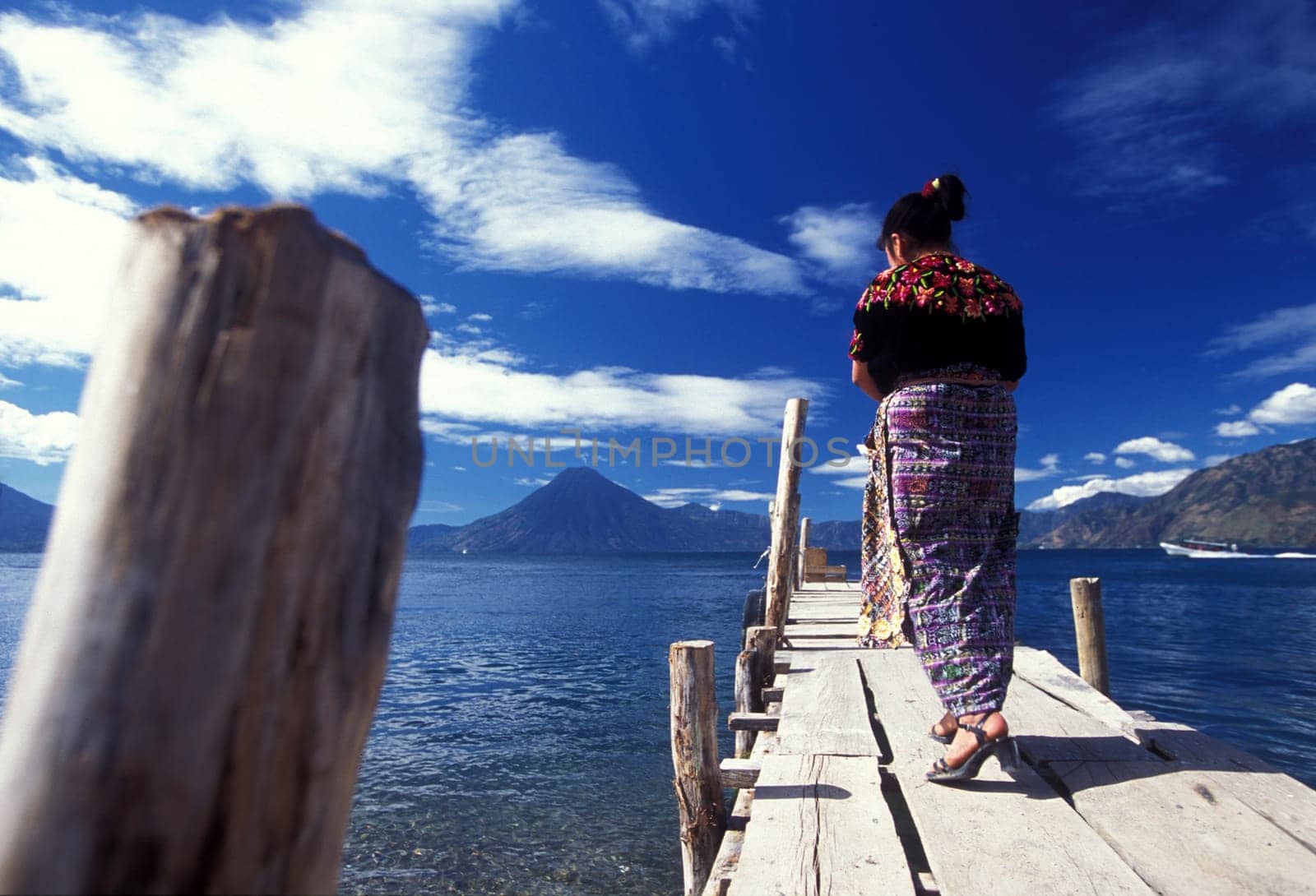 The Lake Atitlan mit the Volcanos of Toliman and San Pedro in the back at the Town of Panajachel in Guatemala in central America.
