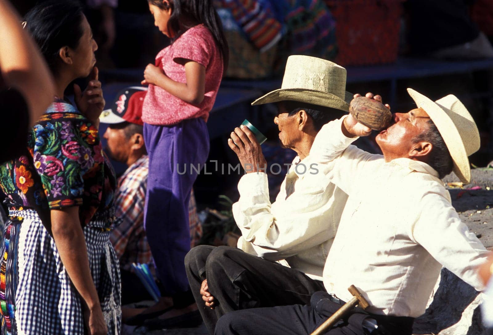 People in traditional clotes at the Market in the Village of Chichi or Chichicastenango in Guatemala in Central America.
