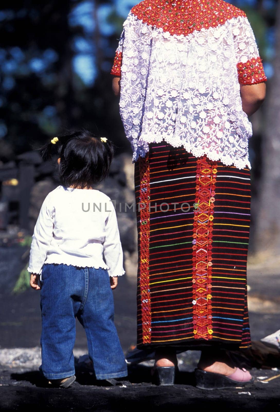 indio women at a religion ceremony in the old town in the city of Antigua in Guatemala in central America.