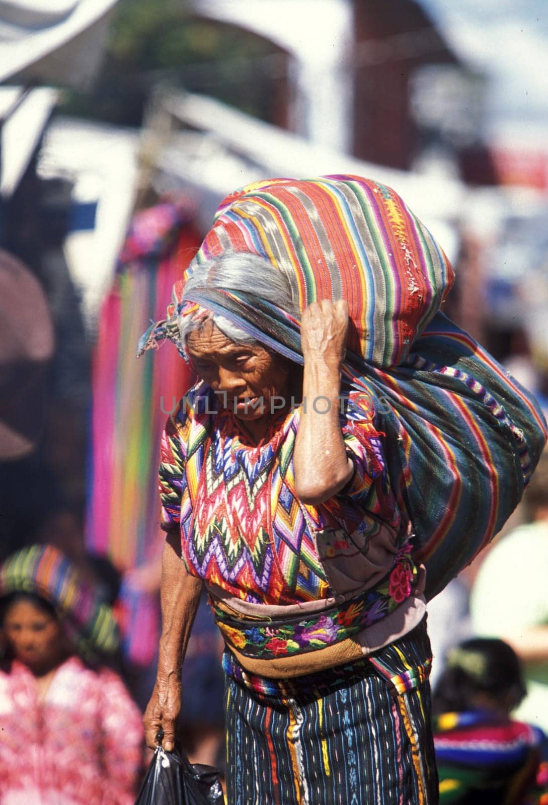 People in traditional clotes at the Market in the Village of Chichi or Chichicastenango in Guatemala in Central America.
