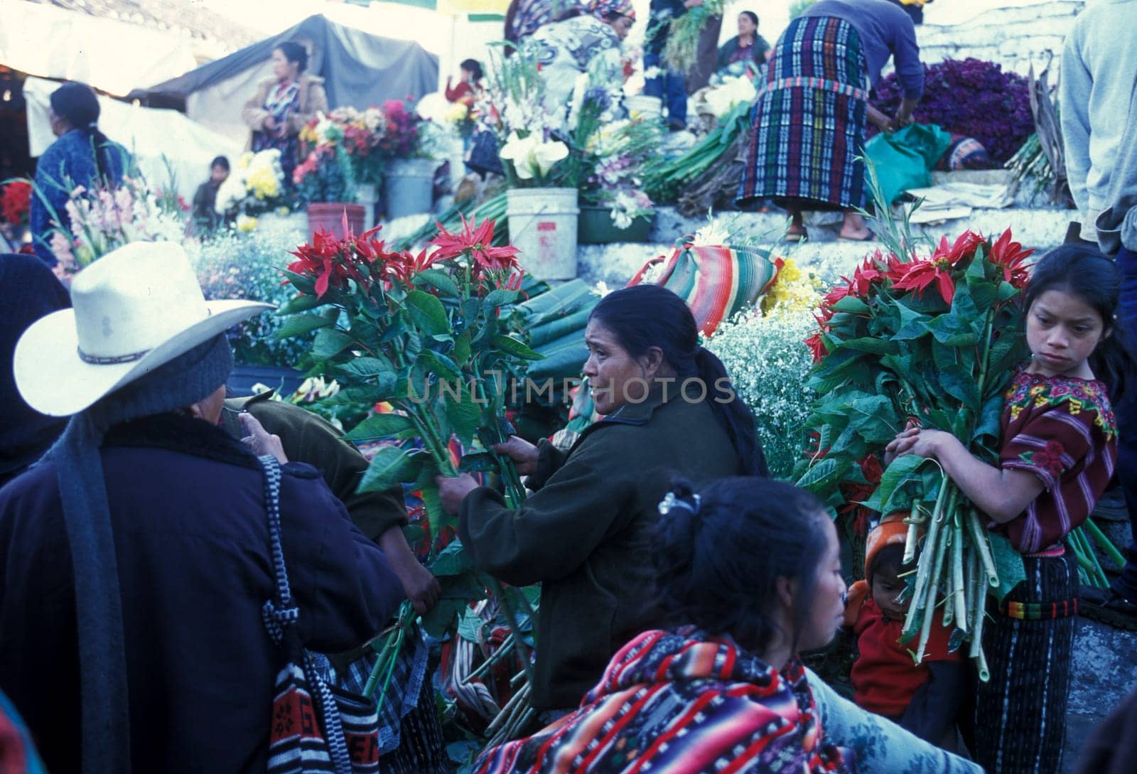 People in traditional clotes at the Market in the Village of Chichi or Chichicastenango in Guatemala in Central America.