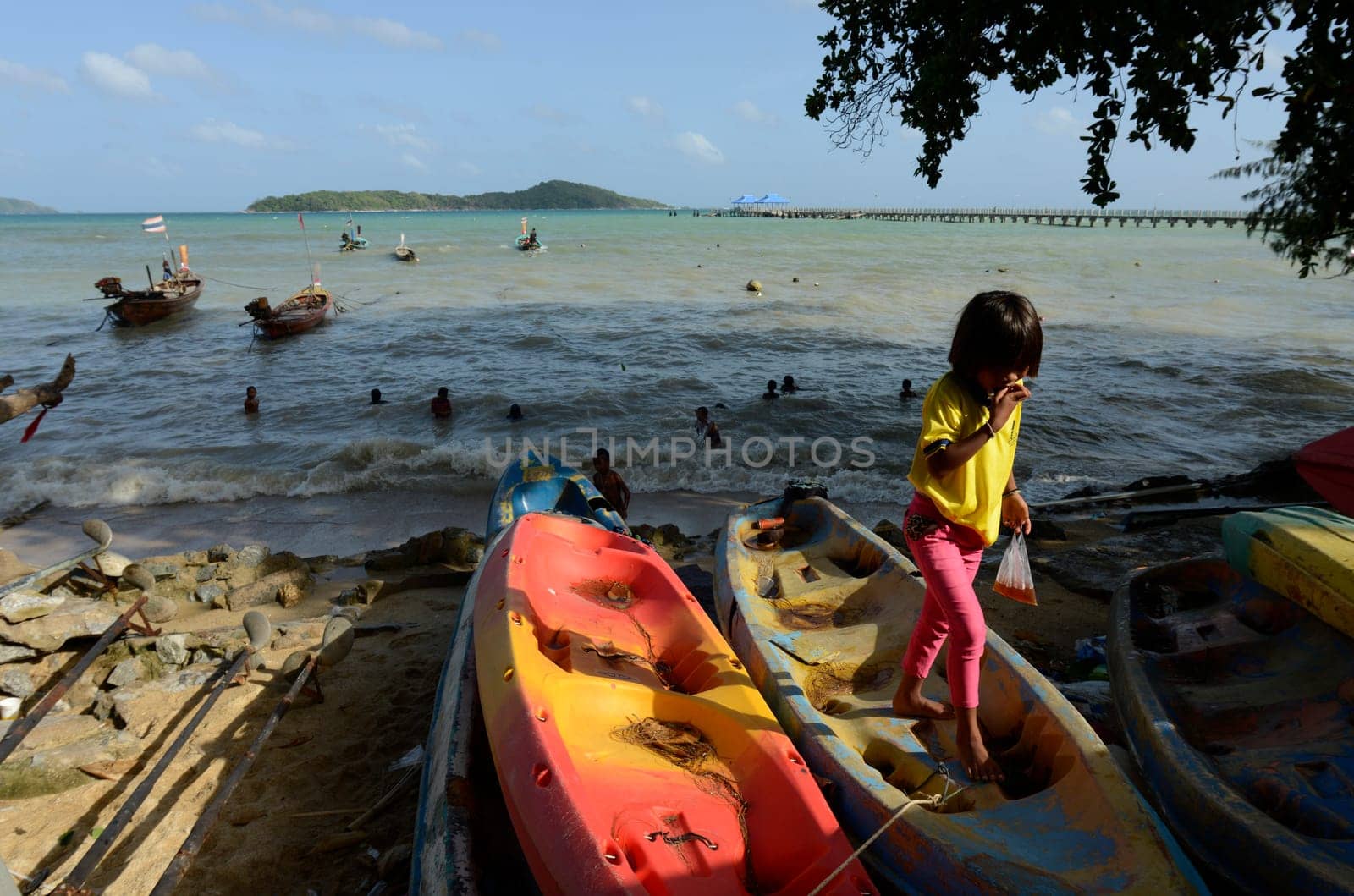 childen on the Beach at the fishmarket in Rawai on the Rawai Beach on the Phuket Island in the south of Thailand in Southeastasia...