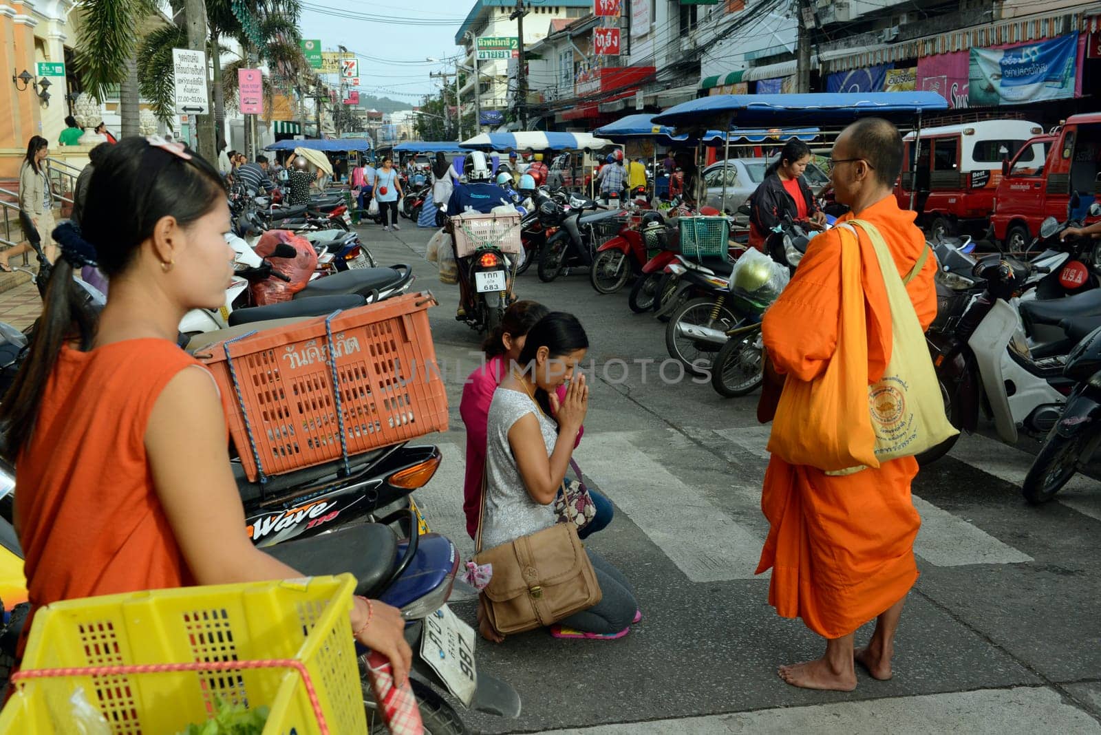 people praying at the day Market in the city of Phuket on the Phuket Island in the south of Thailand in Southeastasia...