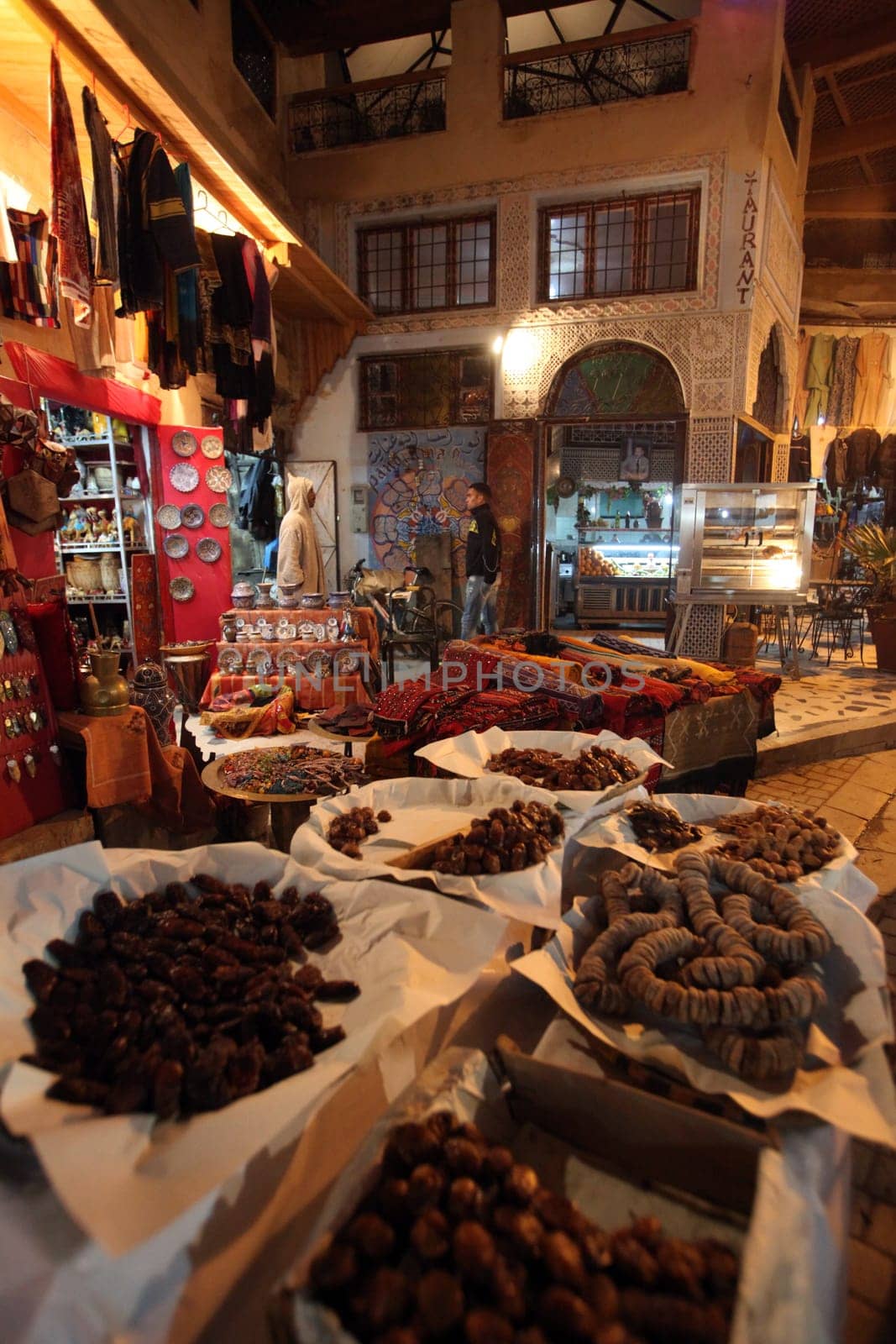 a smal Marketroad in the Medina of old City in the historical town of Fes in Morocco in north Africa.